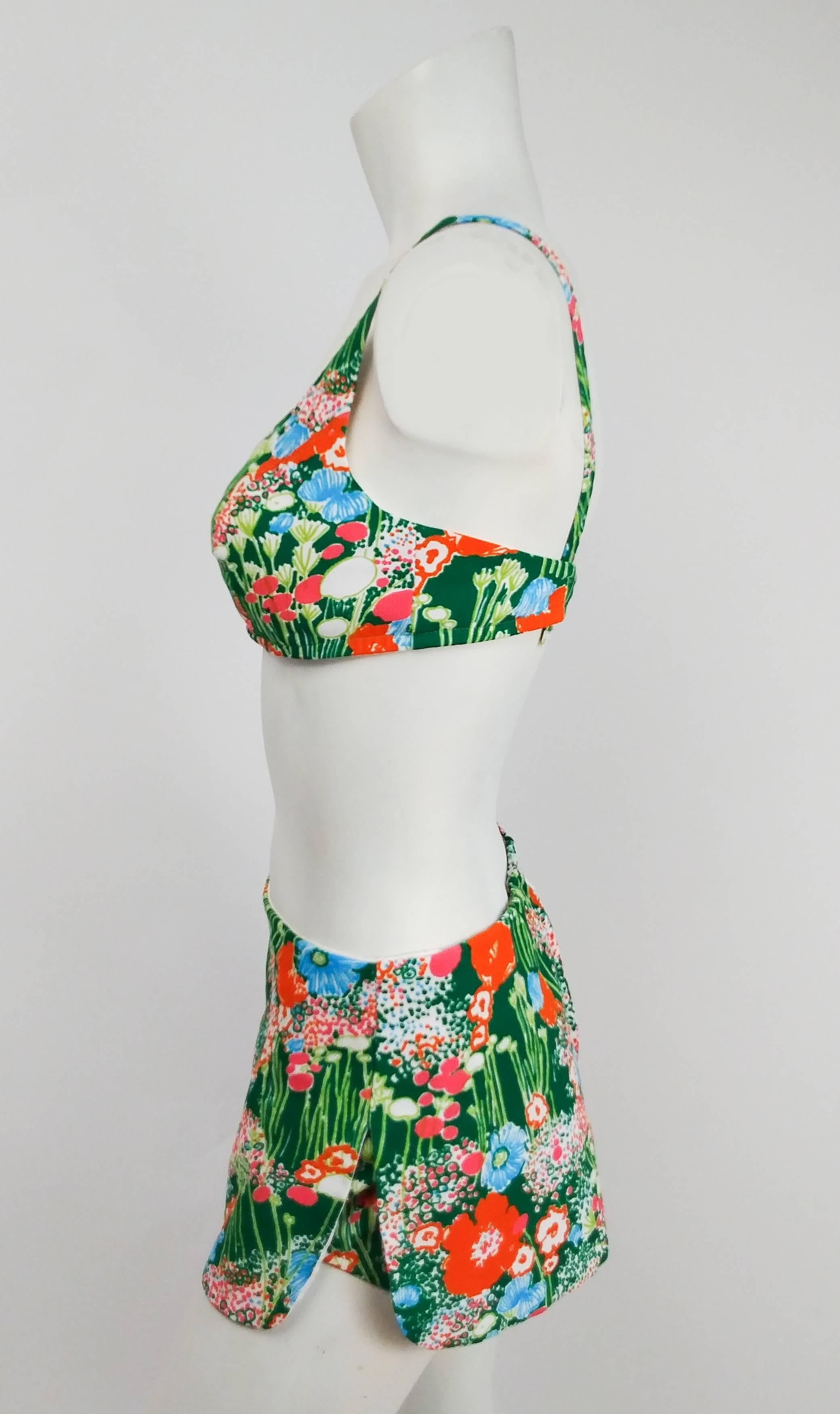 1960s Flower Print Two Piece Bikini Swimsuit. Top has built-in bra and adjustable back straps. Skirt bottom zips up back. 
