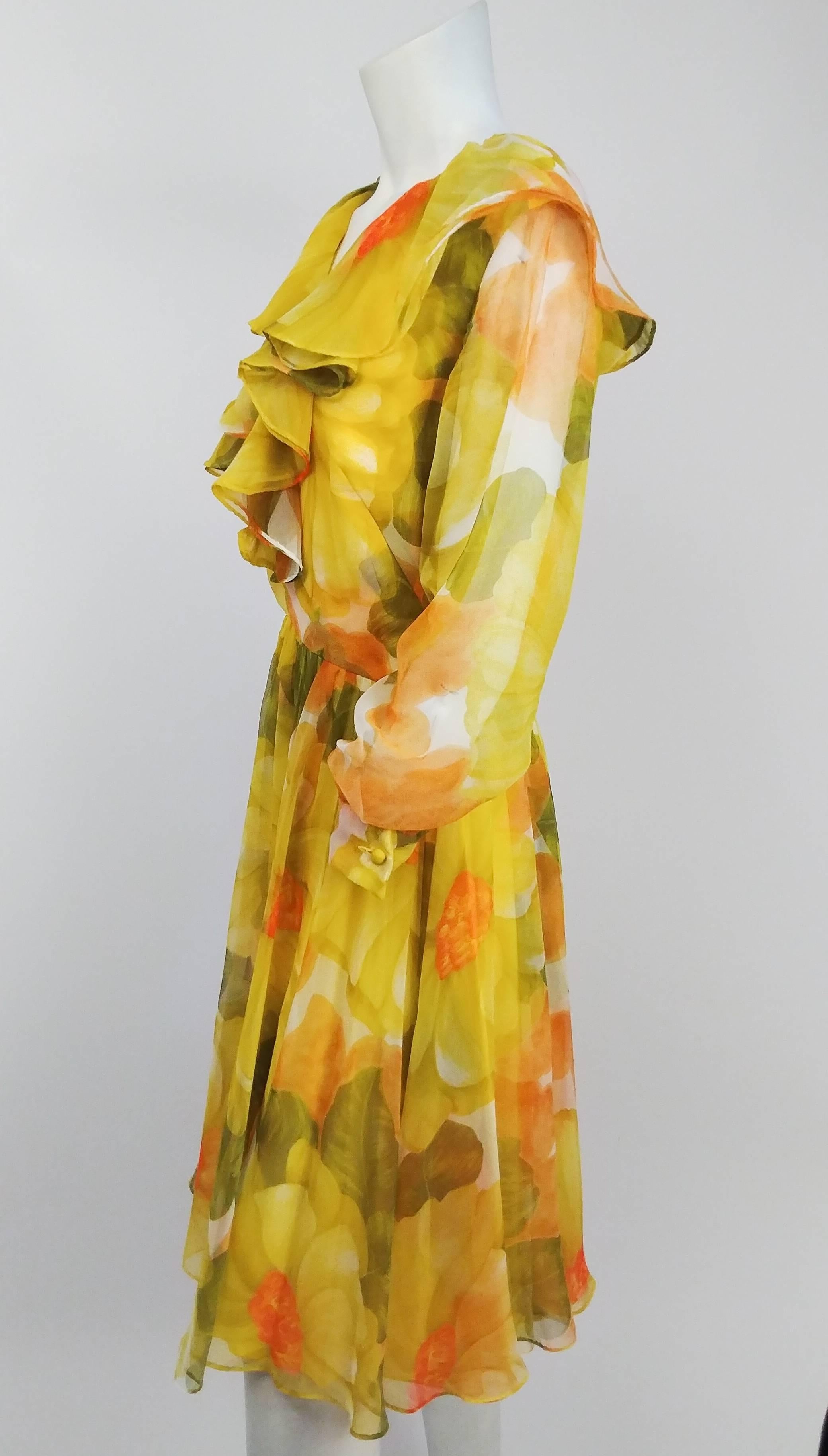 1980s I. Magnin Yellow Flower Print Chiffon Dress. Front ruffle collar detail. Lined bodice and skirt. 