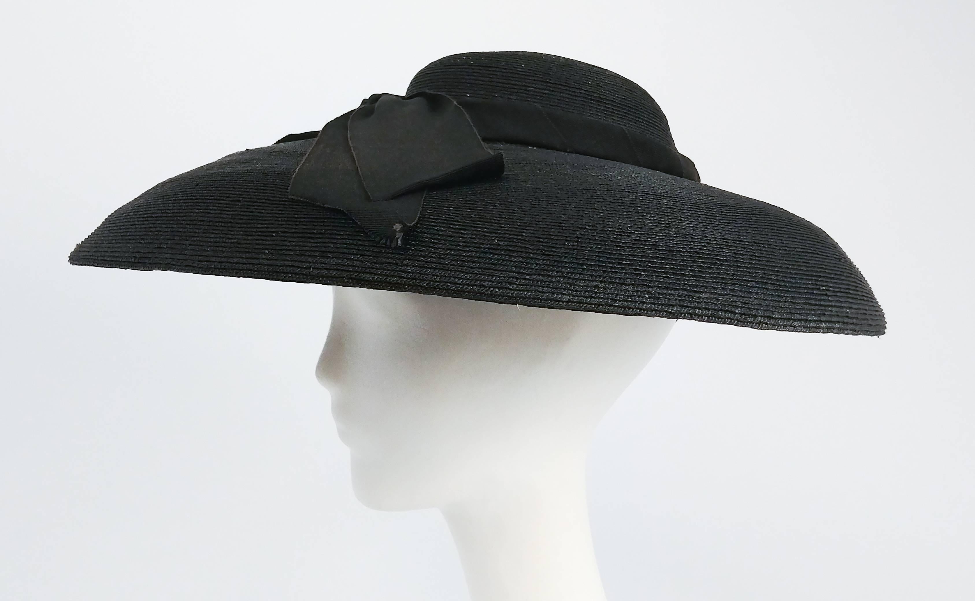 1950s Black Woven Sun Hat w/ Large Bow. Large domed shape, held in place with elastic. 