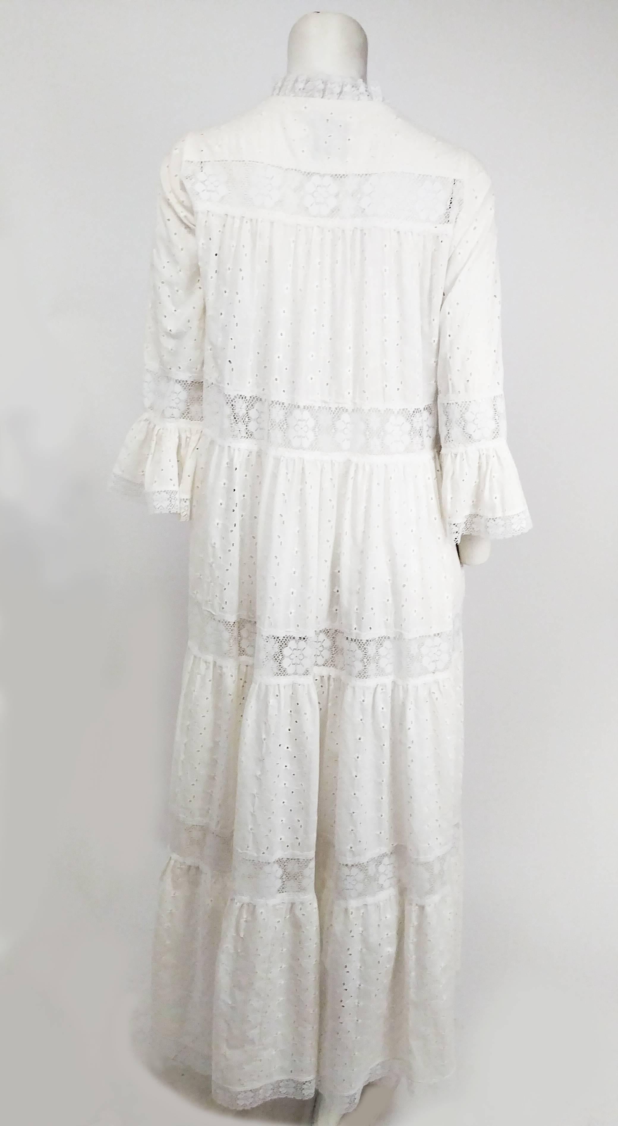 1970s White Lace Bohemian Maxi Dress. Zip up front closure, buttons at collar. Elbow length flounced sleeves. Unlined.