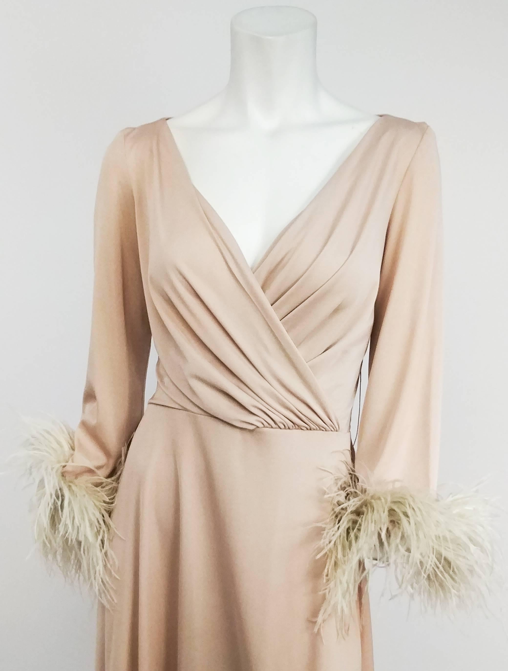 1970s Lilli Diamond Nude Dress with Feather Trim. Stretch jersey nude dress with draped bodice and feather trimmed sleeves. Zips up back.