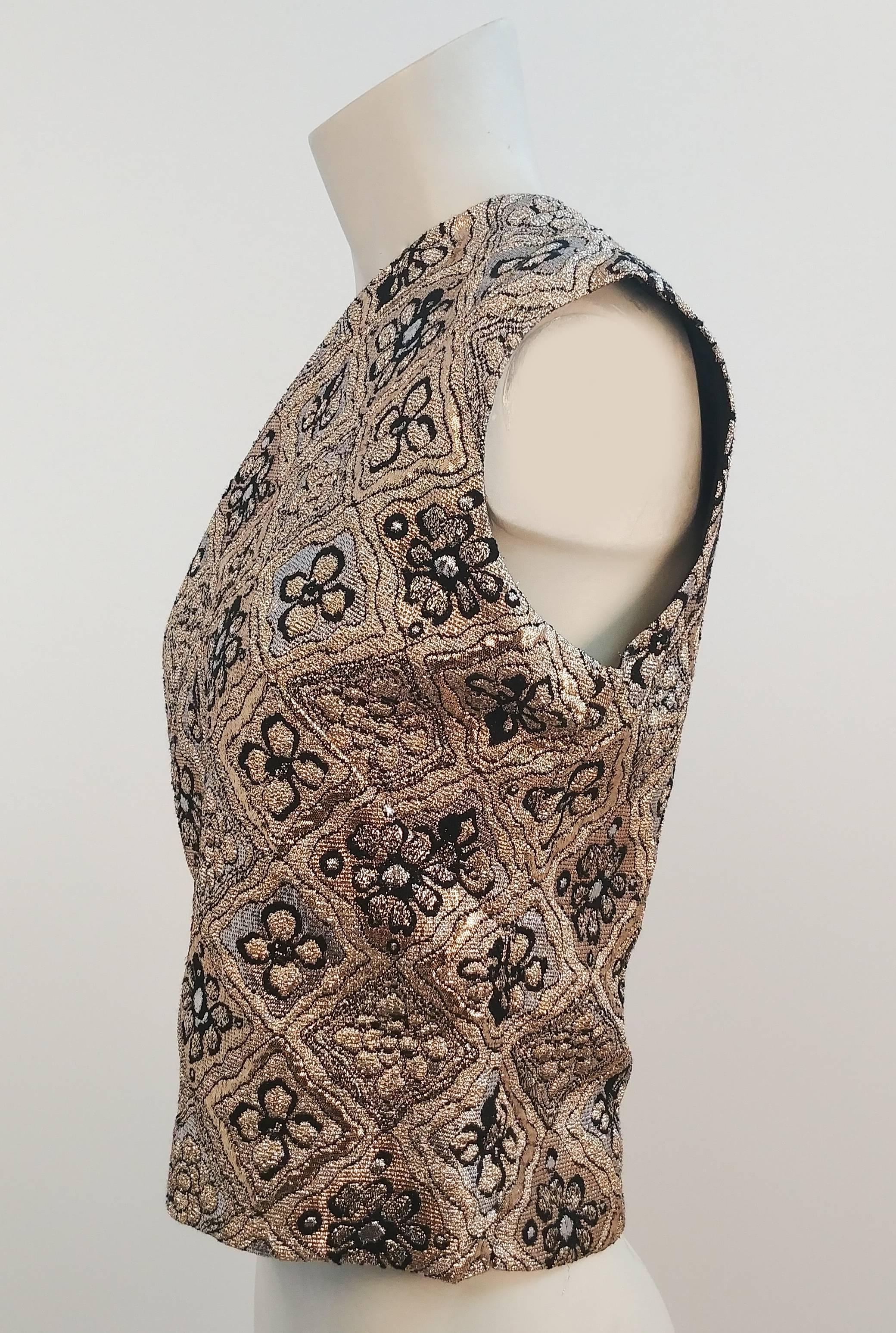 1960s Gold Lamé Sleeveless Top. Geometric design with flowers in the center of each diamond. Zips up back with metal zipper. 