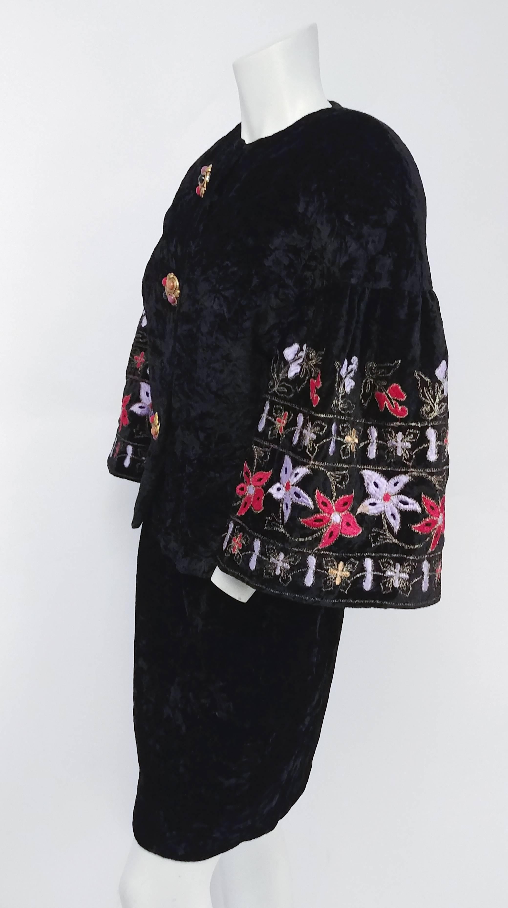 1980s Victor Costa Black Crushed Velvet Suit Set w/ Embroidered Flower Sleeves. Statement buttons adorn the front of this jacket, matching the floral embroidery on the dramatic bell sleeves. Matching skirt. 