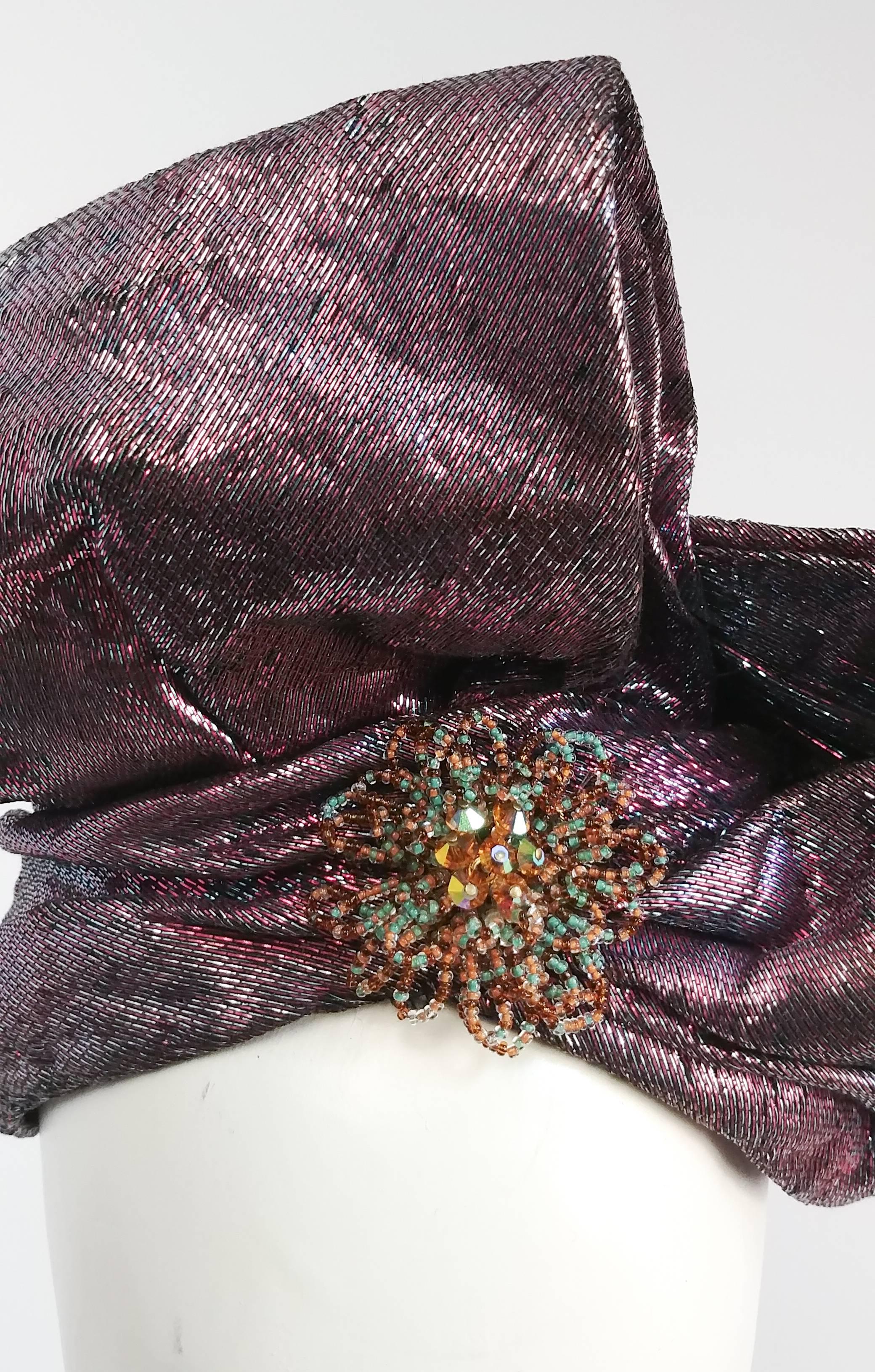 1980s Metallic Pink/Purple Wrapped Turban Hat w/ Bow. Metallic fabric has pink and green threads for duo tone reflect. Large ruched bow finished at center with green and copper beaded brooch. 