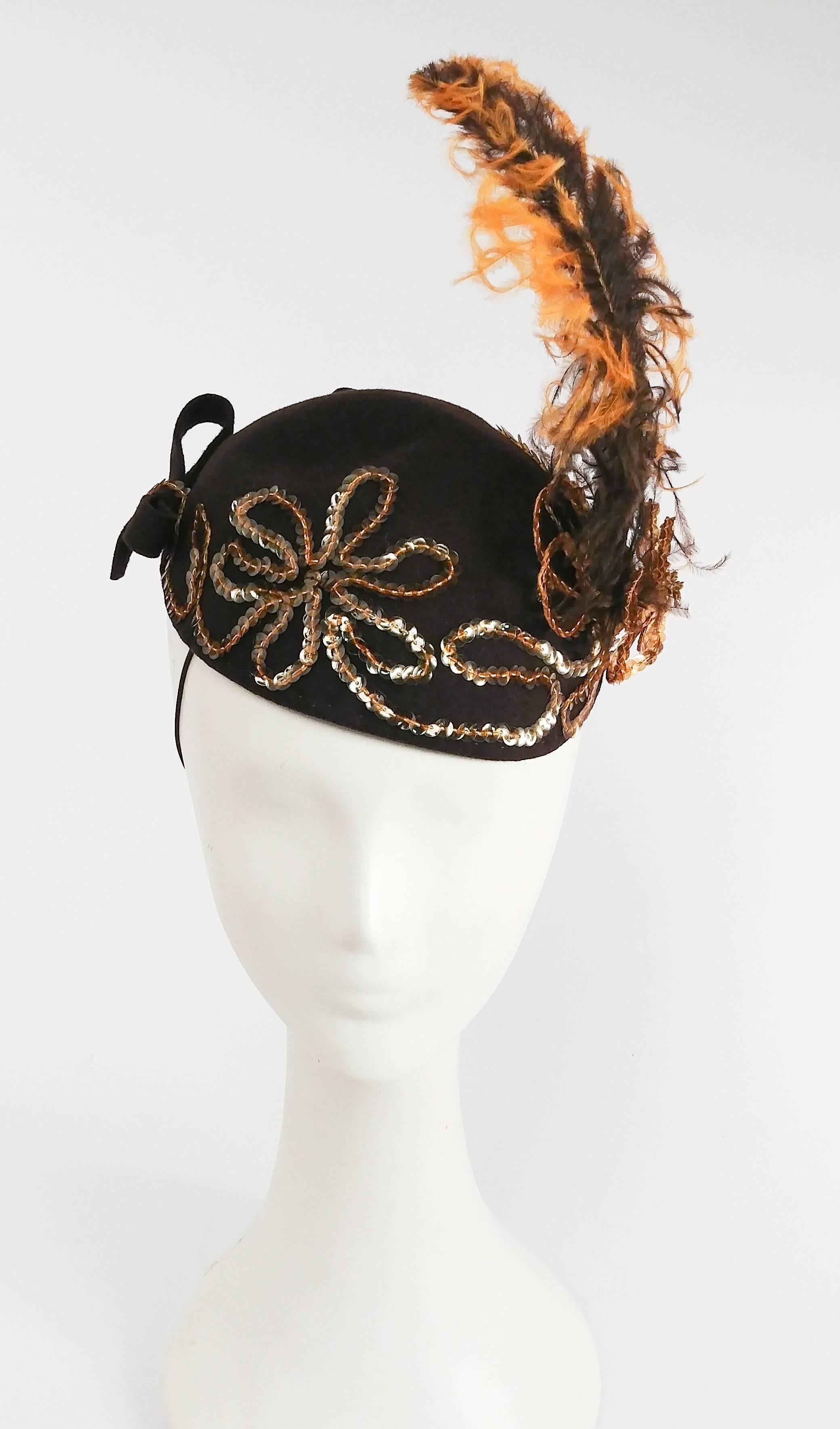1930s Gold Sequin Brown Hat with Ombre Feather. True vintage jelly sequins, three dimensional sequin flowers and felt bows. Held to head with elastic band. 