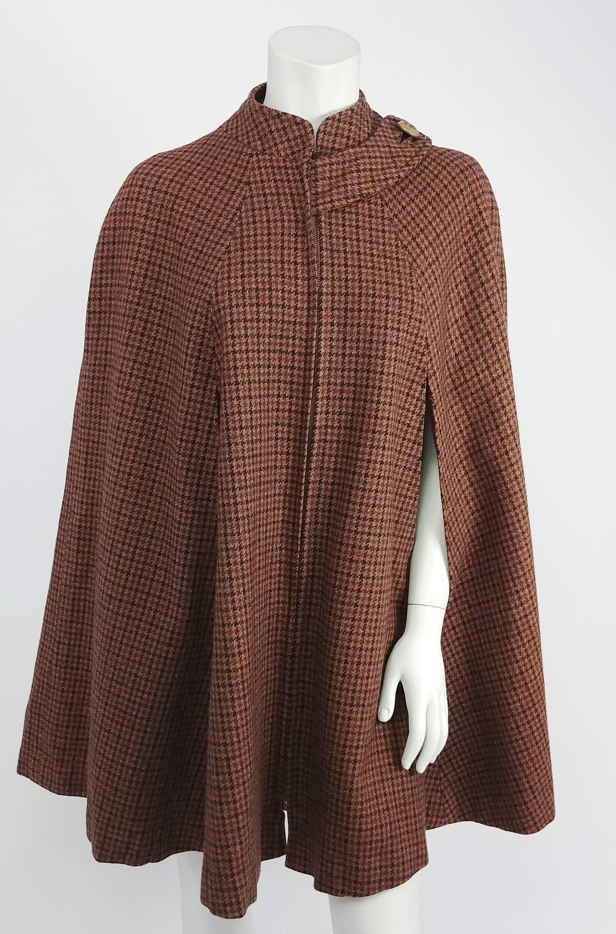 1960s Brown & Burgundy Houndstooth Wool Cape. Zips up front, buttons on one shoulder. Fully lined. Slits in front for arms. 