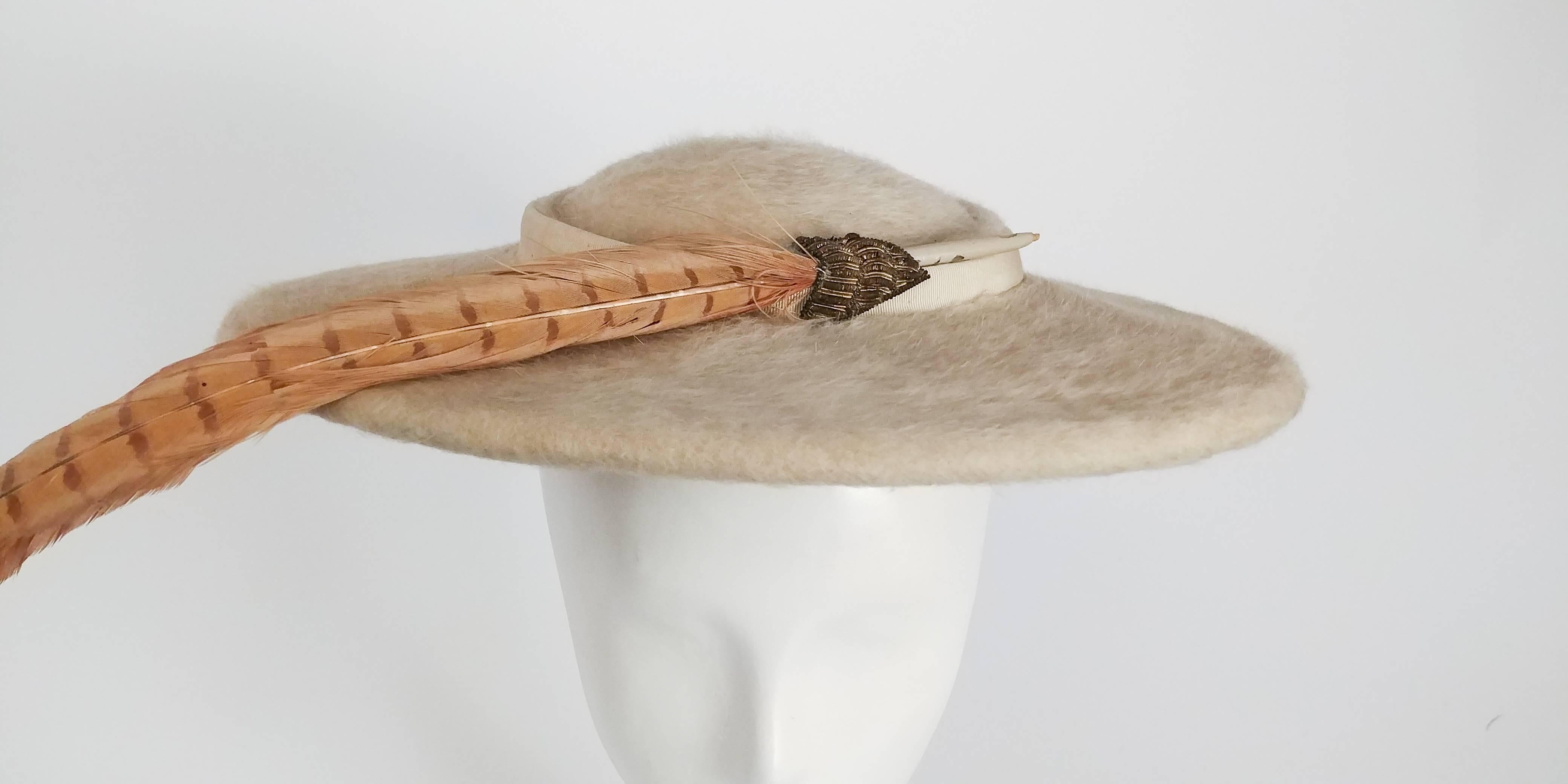 1950s Cream Felt Saucer Hat w/ Pheasant Feather. Fits comfortably to most heads. 