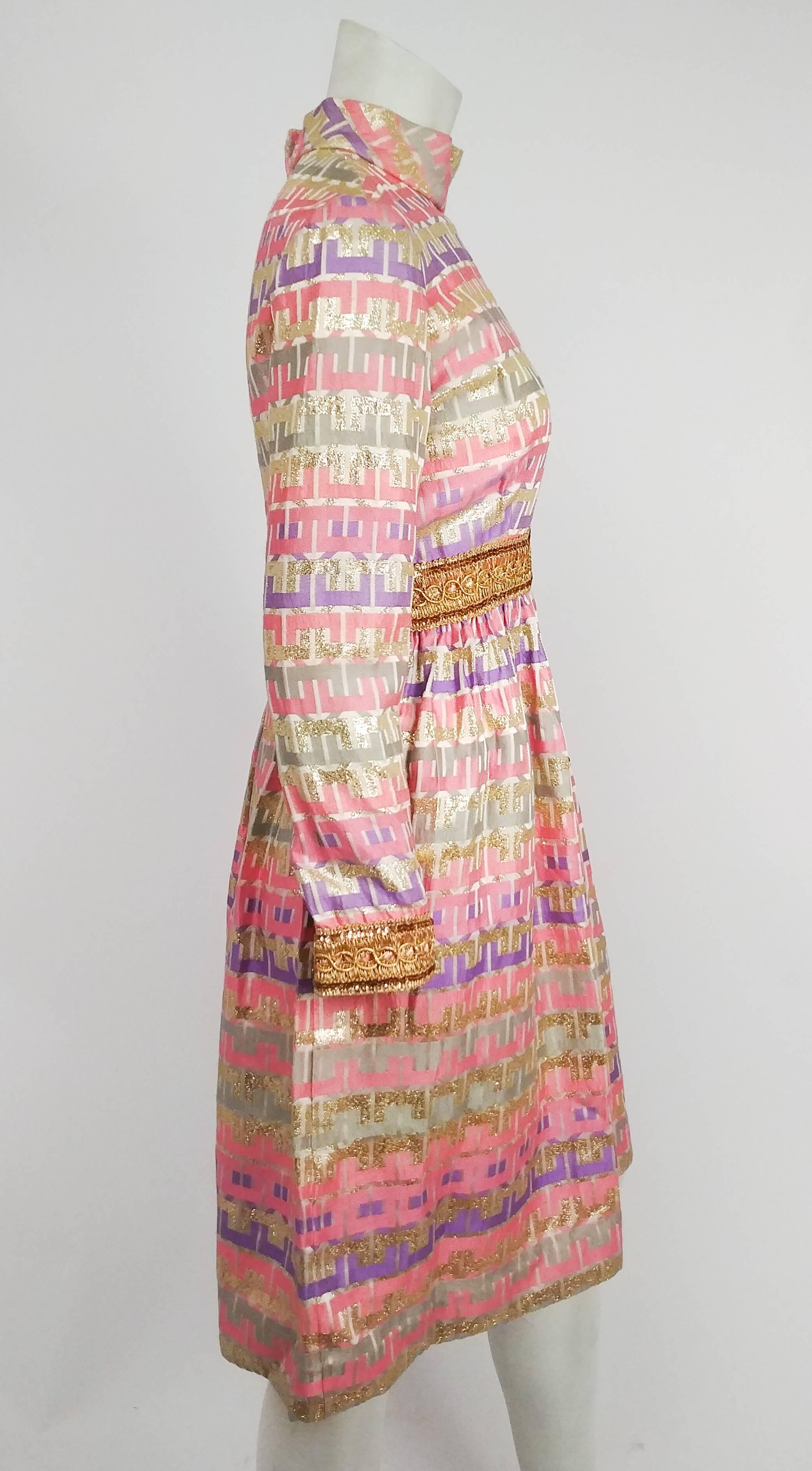 960's Oscar de la Renta Boutique multi-color metallic silk brocade dress. High collar, metallic ribbon belt and cuffs. Zips up back. All-over geometric pattern in pink, gold, and purple. 