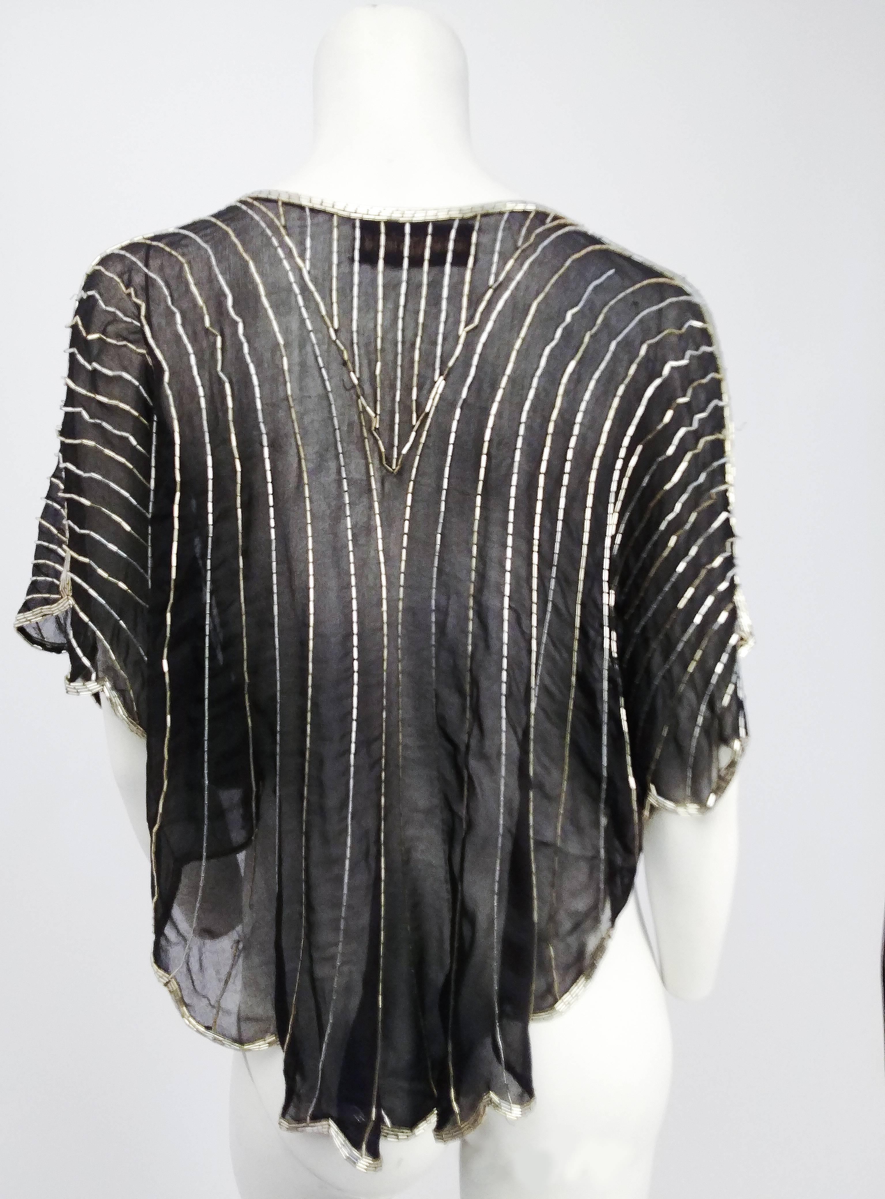 1980s Judith Ann Black & Silver Beaded Silk Chiffon Batwing Top. Silver beads on black chiffon. Scalloped hem, also trimmed with silver beading. Loose fit.