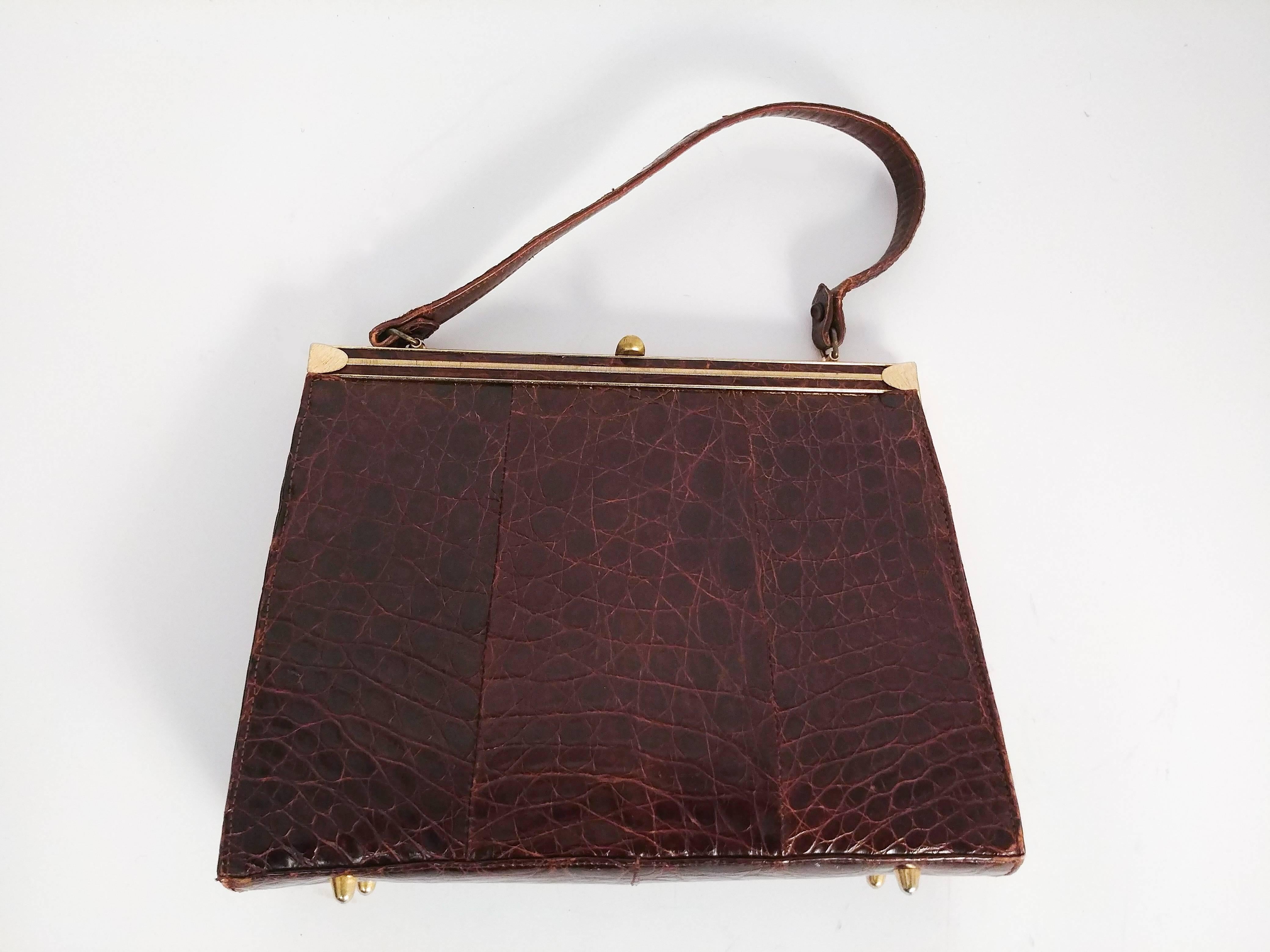 1940s Brown Alligator Handbag. Slightly tapered shape. Pieced three panel design. Gold tone hardware. Beautiful cognac leather interior, comes with coin purse. 