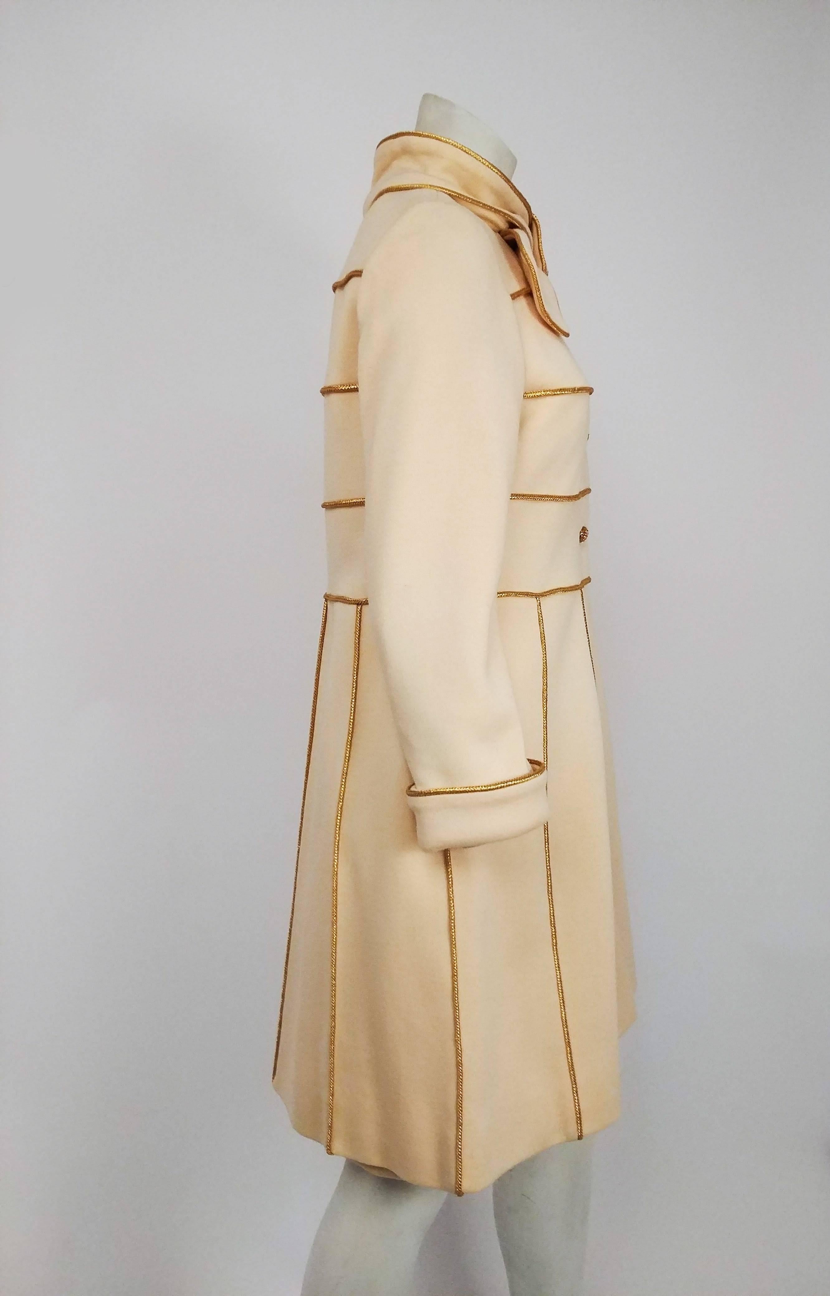 1960s Lilli Ann Knit Gold & Cream Dress & Coat Set. Cream knit fabric with metallic gold piping. Wrap-around tie collar fastens in place with a snap to look like a bow at neck, pleated skirt of coat with embellished with gold piping. Sheath dress