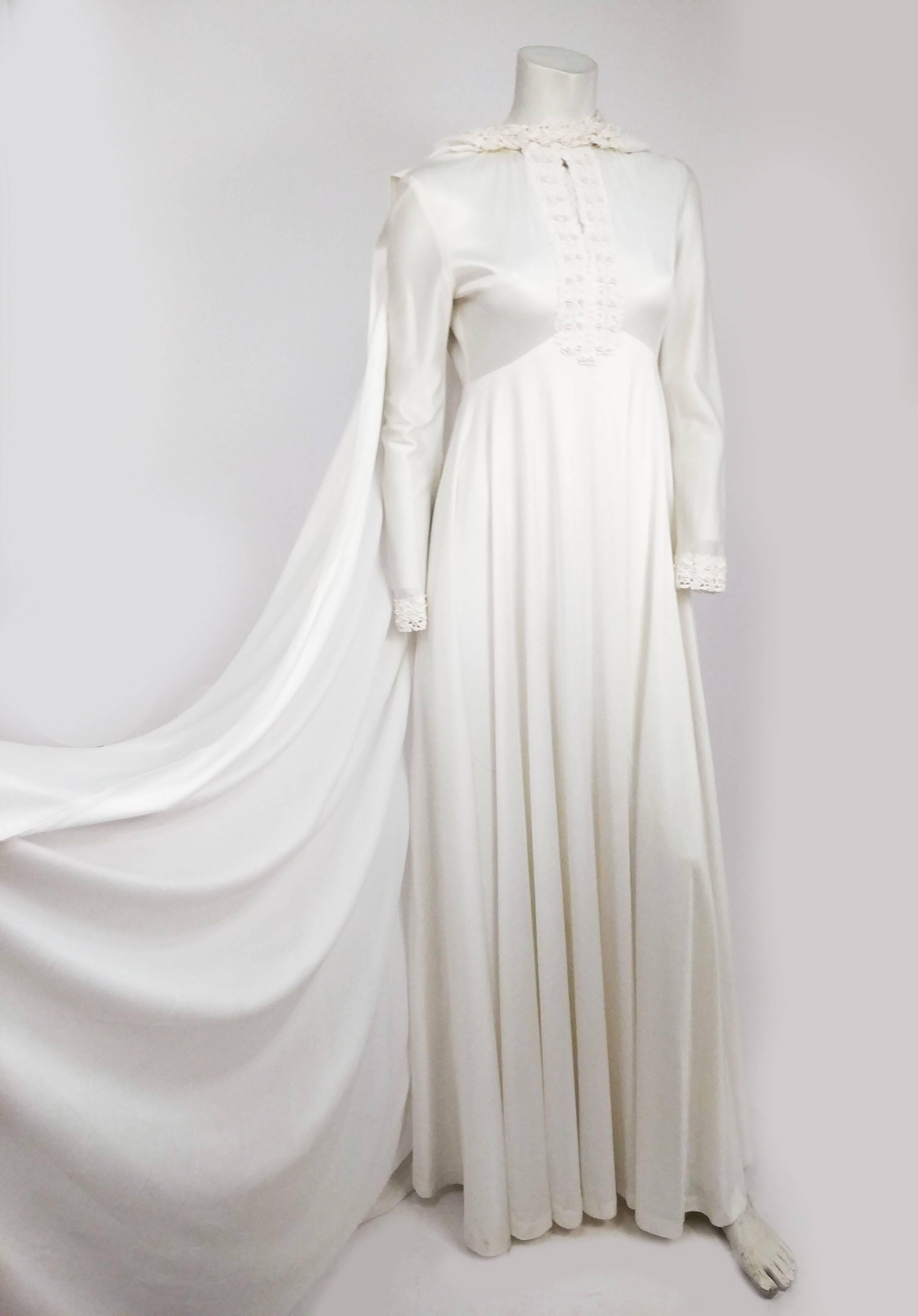1970s White Maxi Dress w/ Hood & Cape. Angelic 1970s jersey dress with lace collar and detectable hood which hooks onto collar with hooks and eyes. 