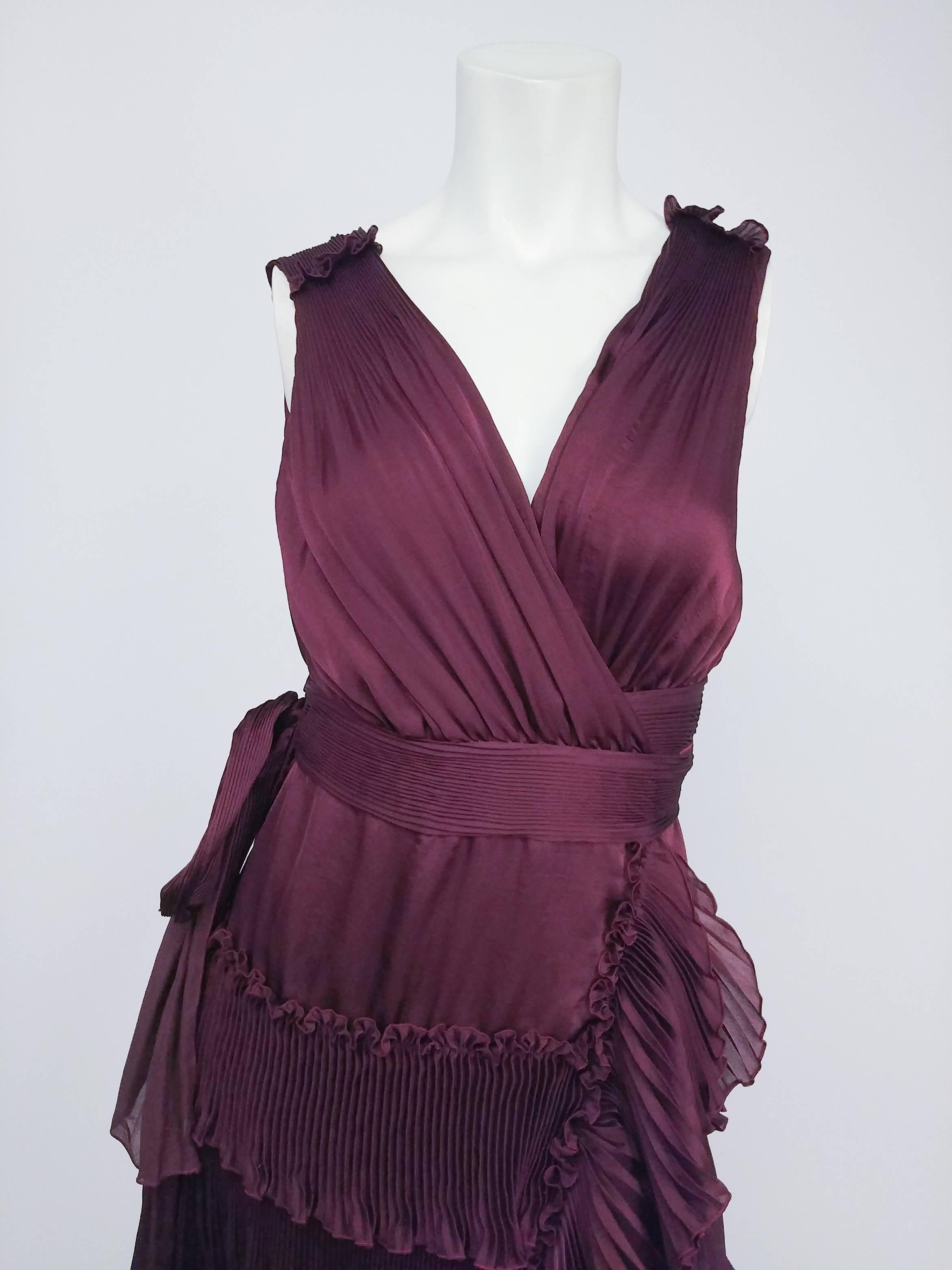 Diane von Furstenberg Purple Pleated Ruffle Wrap Dress. Classic Diane von Furstenberg wrap dress, this eggplant purple cocktail number boasts rows of set pleated ruffles for an ethereal, floating effect. The waist ties feed through the side seam to