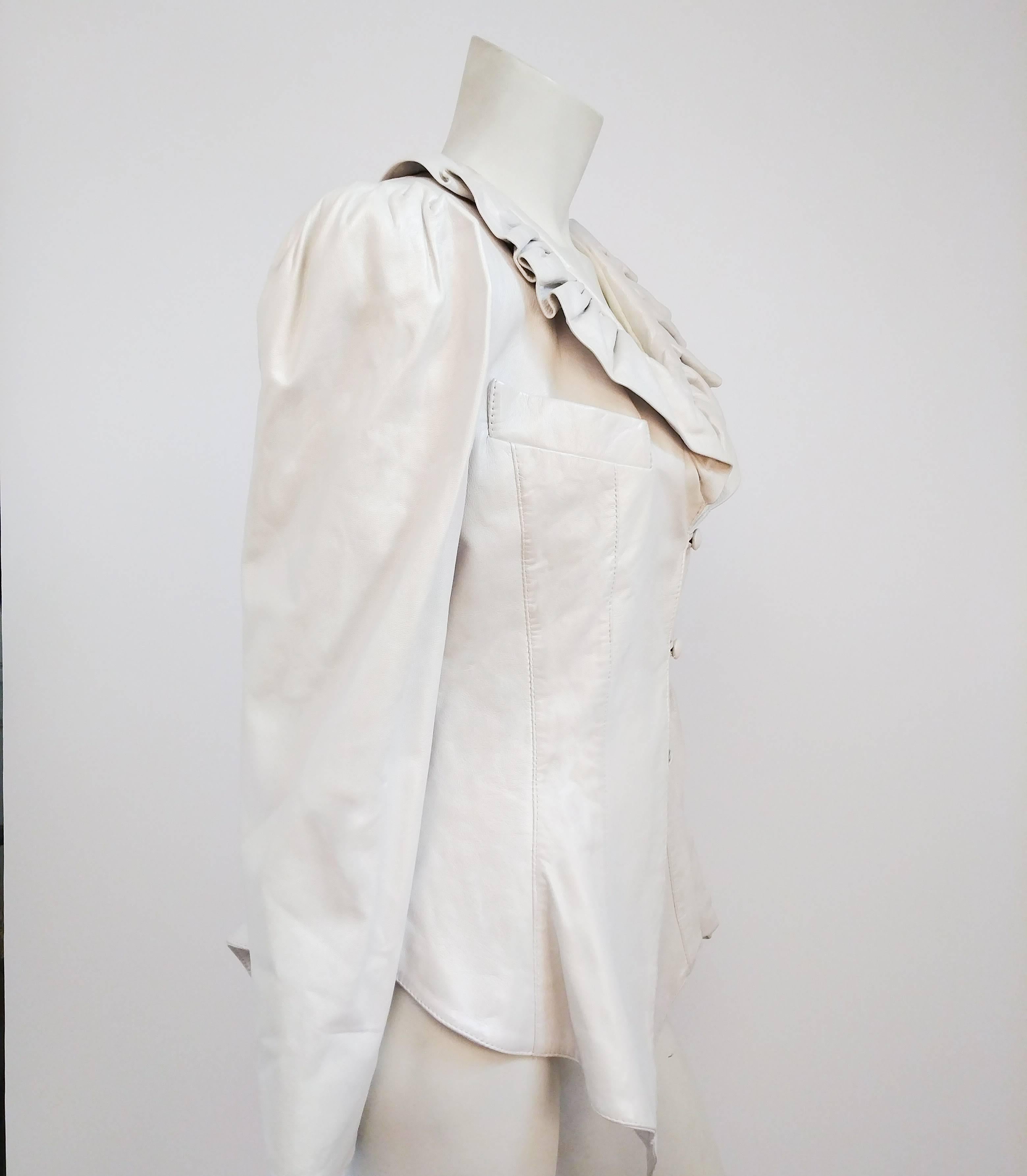 1980s White Leather Jacket . Ruffled collar, buttons down center front. Puffed sleeved pleated into armhole. Flared peplum silhouette. 