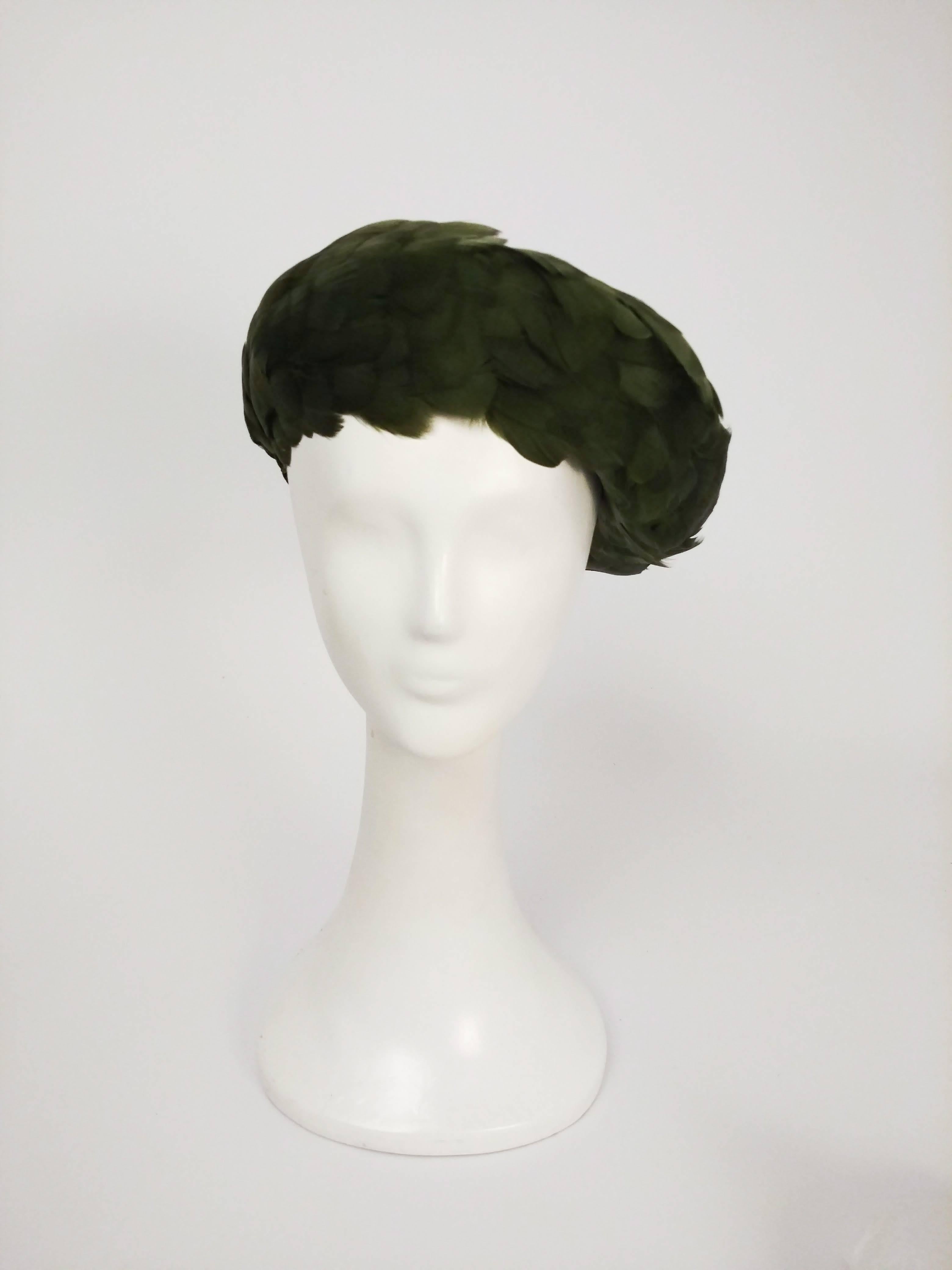 1960s Olive Green Feather Beret. Soft, buttery feathers cover this malleable beret with net base, which can be worn in a variety of ways!