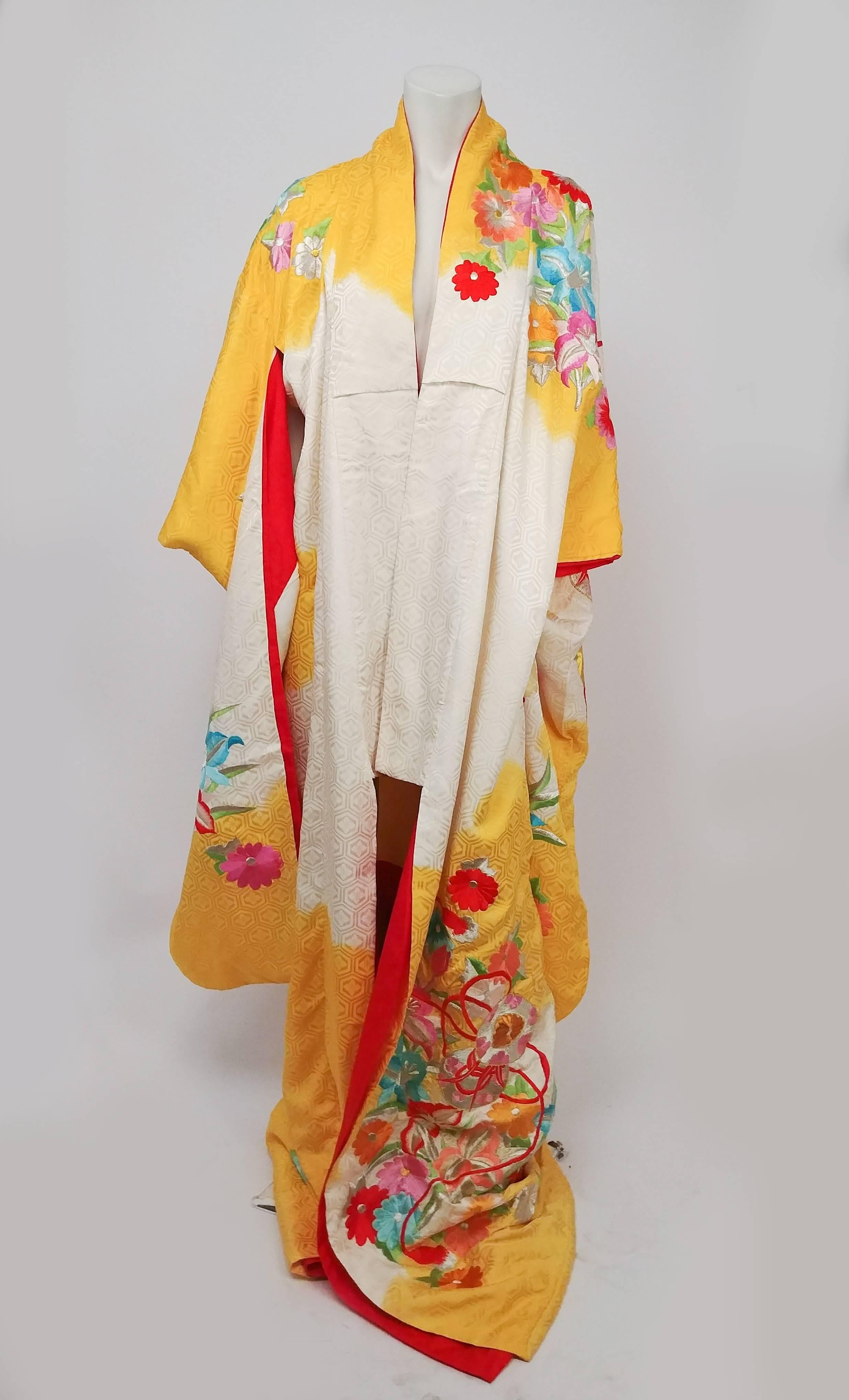 Flowers & Temari Yellow Silk Jacquard Kimono with Colorful Embroidery. Yellow and cream dyed silk jacquard with a hexagonal pattern with woven flowers. Embroidered all over with flowers, ribbon, and temari balls. Lining in red silk that shows at