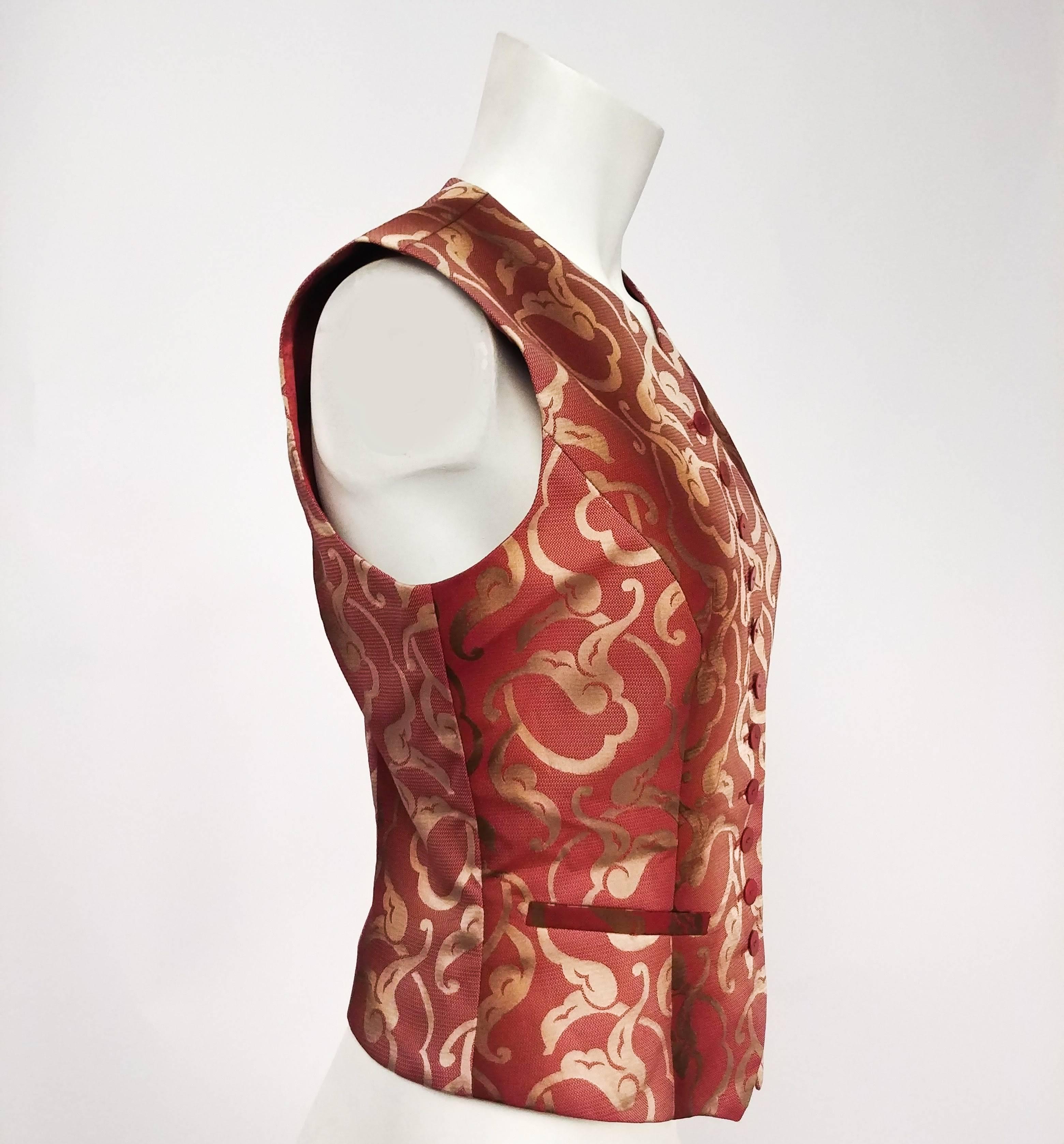 Kenzo Baroque Style Brocade Vest. Elegant red and gold colors with swirling design. Welt pockets at front. Iridescent lining. 