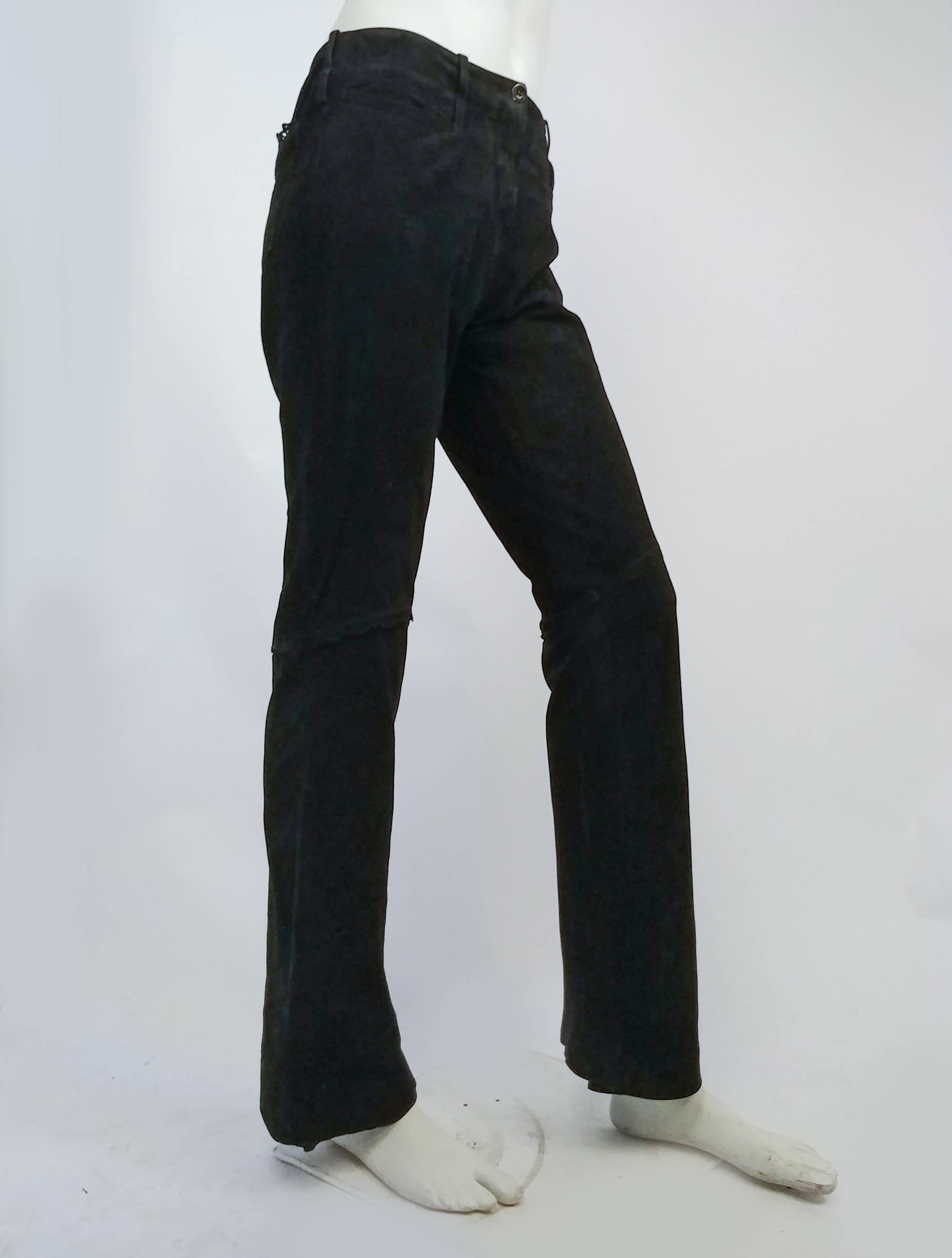 Christian Lacroix Black Suede Pants. Black suede leather pants with deceptive perforations and pseudo-lace detail at back pockets and at knees. Bootleg cut.