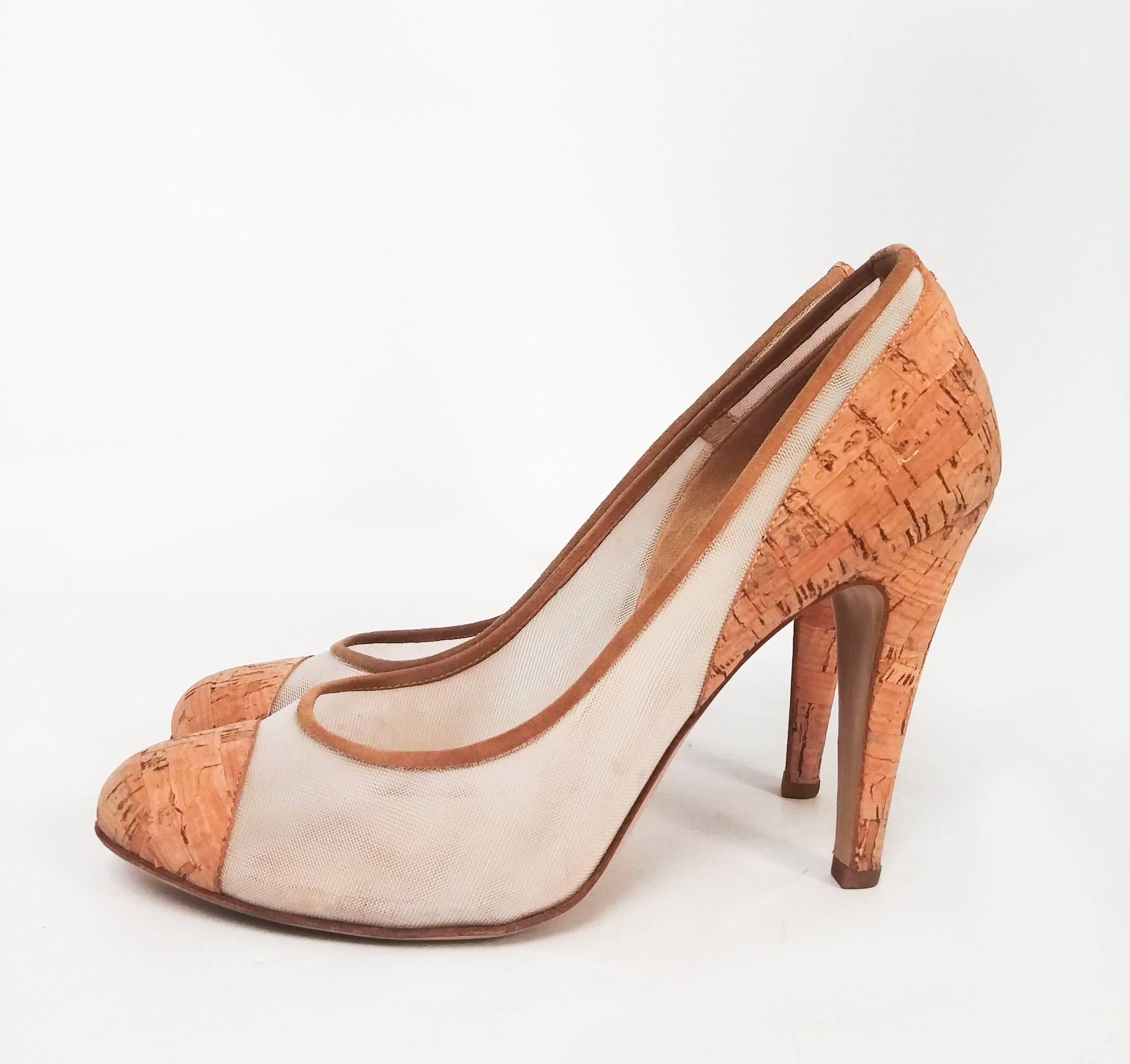 Chanel Cork Two Tone Pumps. Cork toe cap and heels and mesh uppers are an elegant twist on the classic Chanel two-tone shoe. Stiletto heel, double C logo at back. Barely worn.