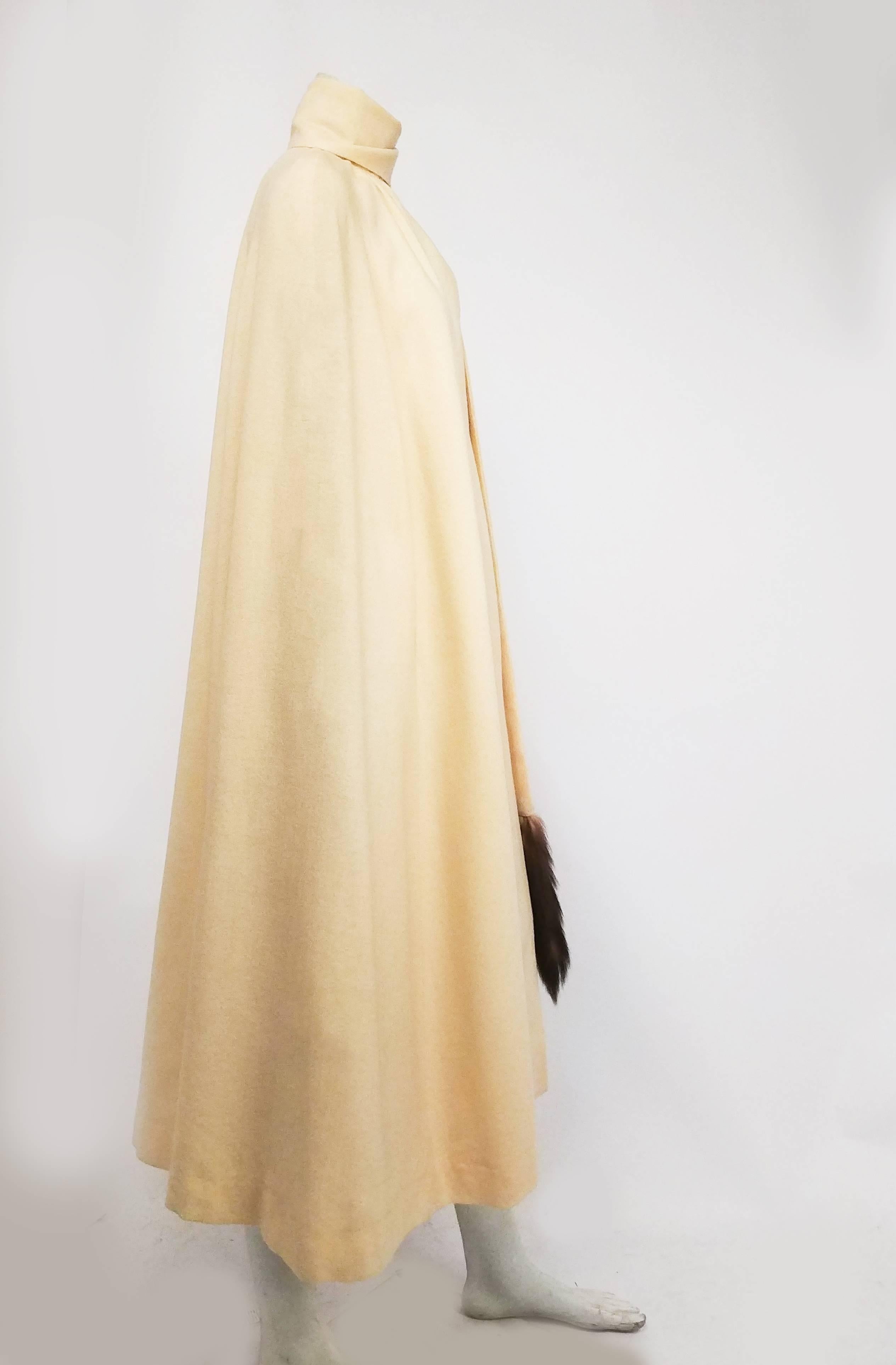 1960s Cream Full Length Wool Cape w/ Mink Tails. Snaps closed at throat. Scarf is attached to back of cape and can be worn in a variety of ways! 