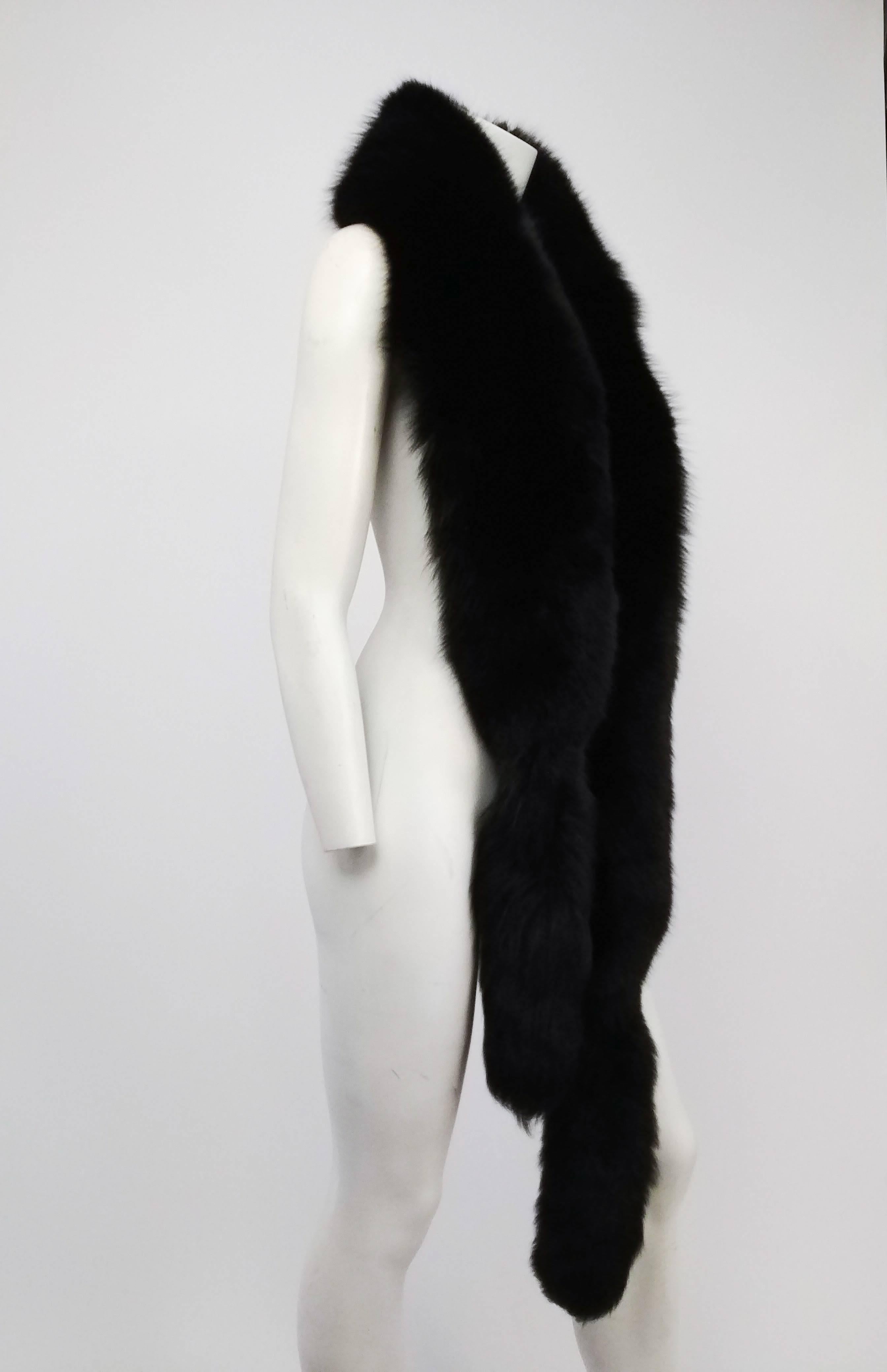 Black Long Black Fox Fur Stole. Tail on each end of stole. Backed with black velvet. 