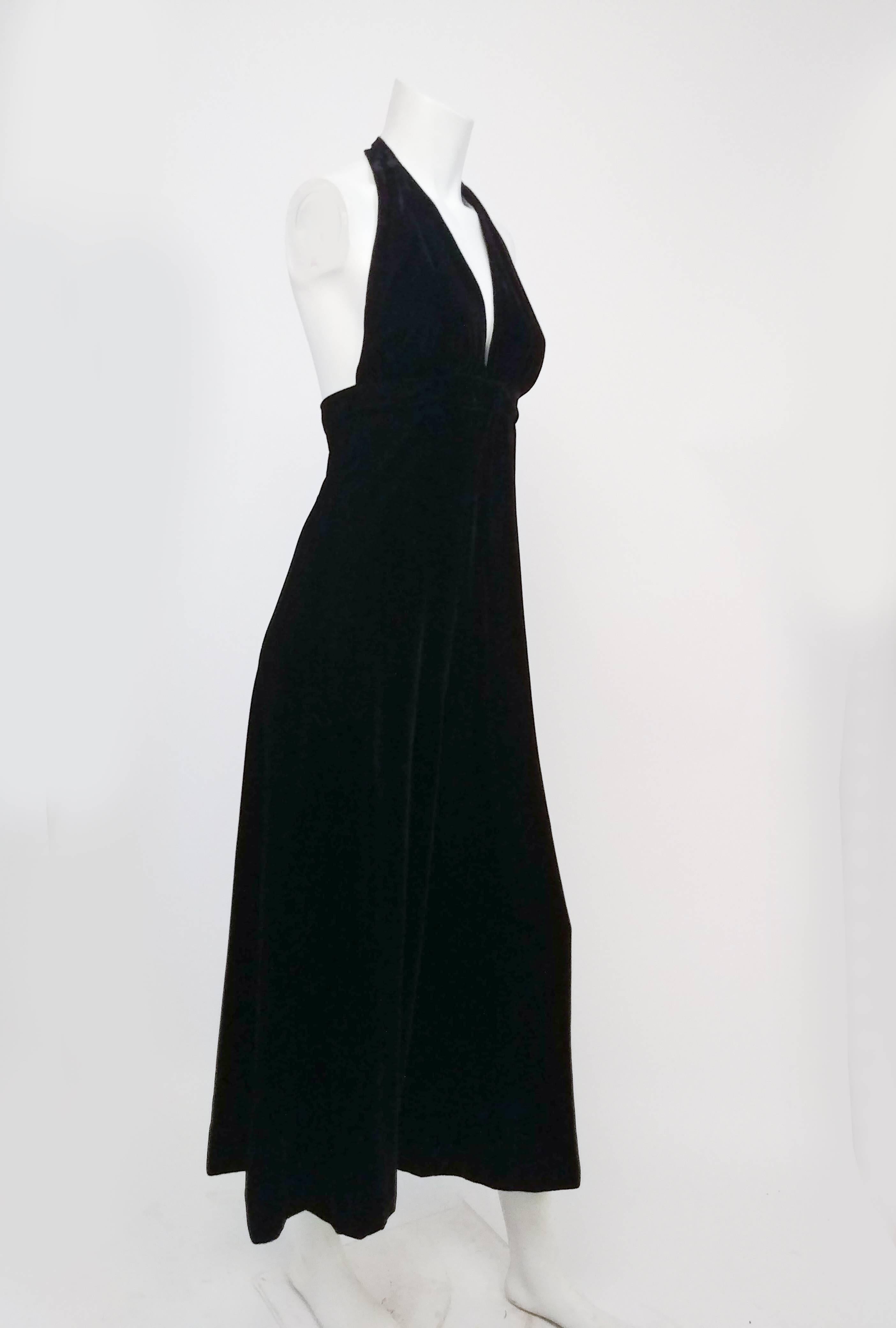 1970s Black Velvet Halter Jumpsuit. Deep-V halter neck, sexy open back. Wide legged pants for lots of movement and drama, zips up back and buttons. 