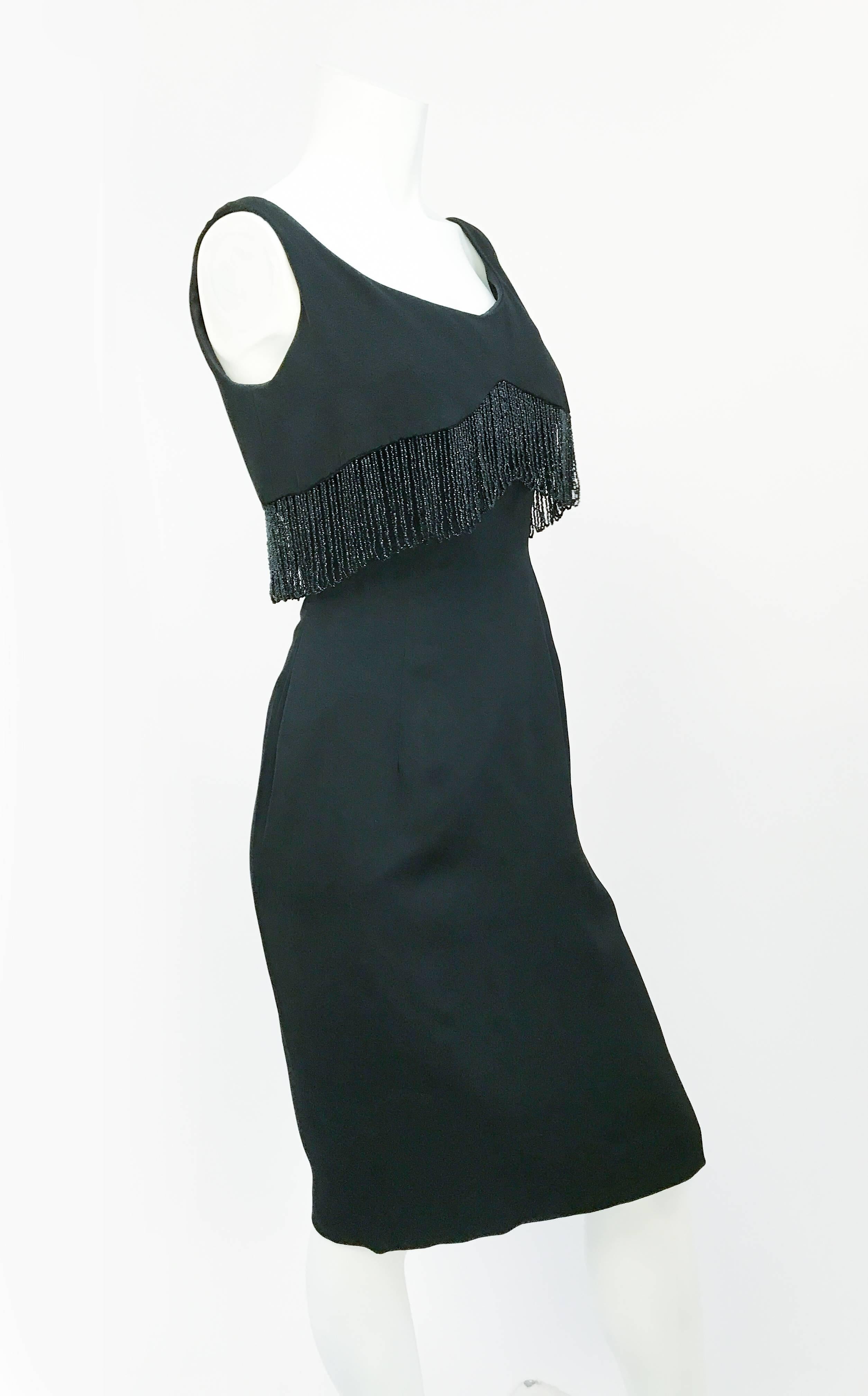 1960s Black Anita Modes Cocktail Dress with Jet Beaded Trim. Black cocktail silk dress with black glass beaded fringe trim around the bust