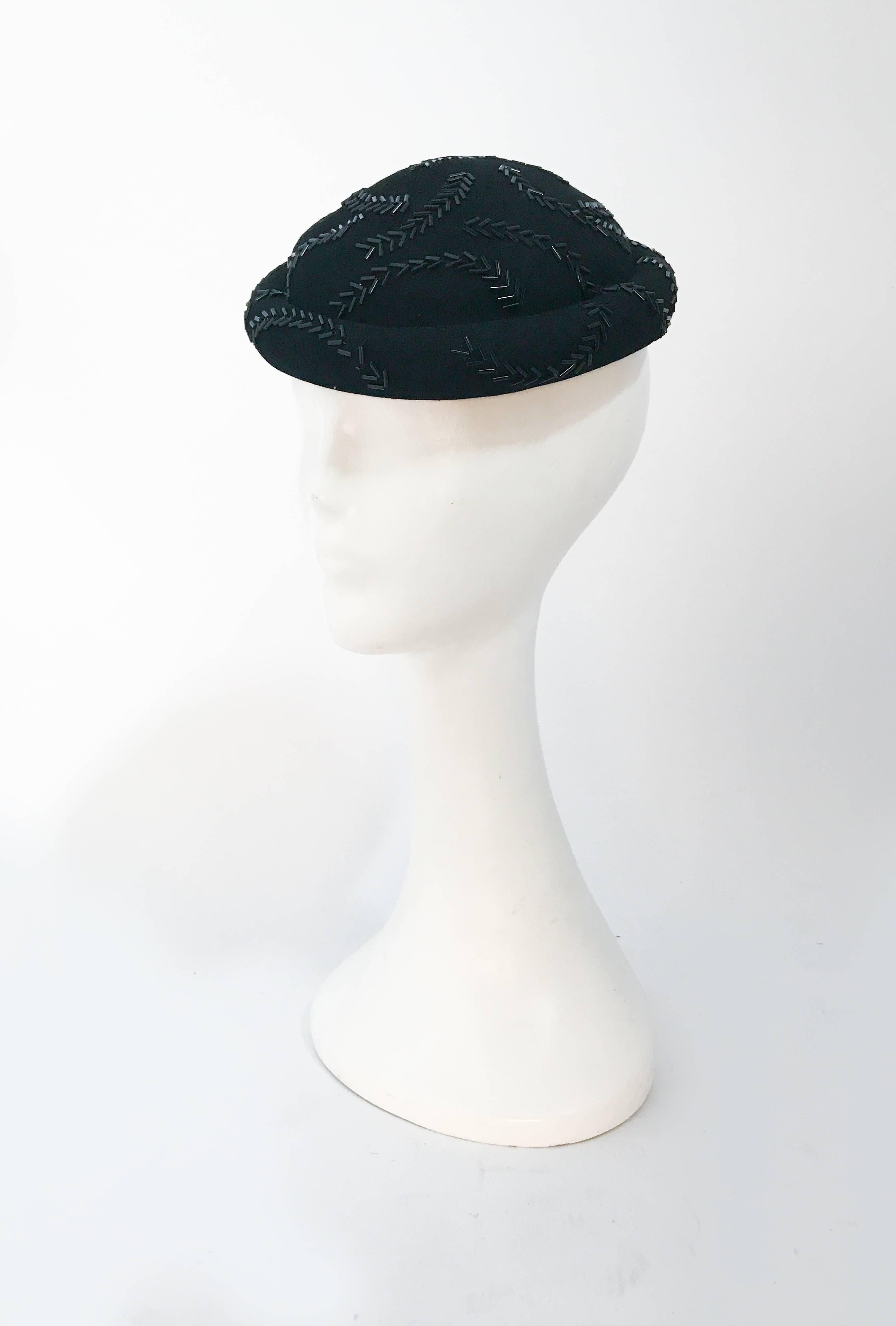 1930s Black Felt Beaded Cocktail Hat. Black felt cocktail hat with glass hand beaded embellishments and rolled brim. Elastic is used to secure the hat to the head.