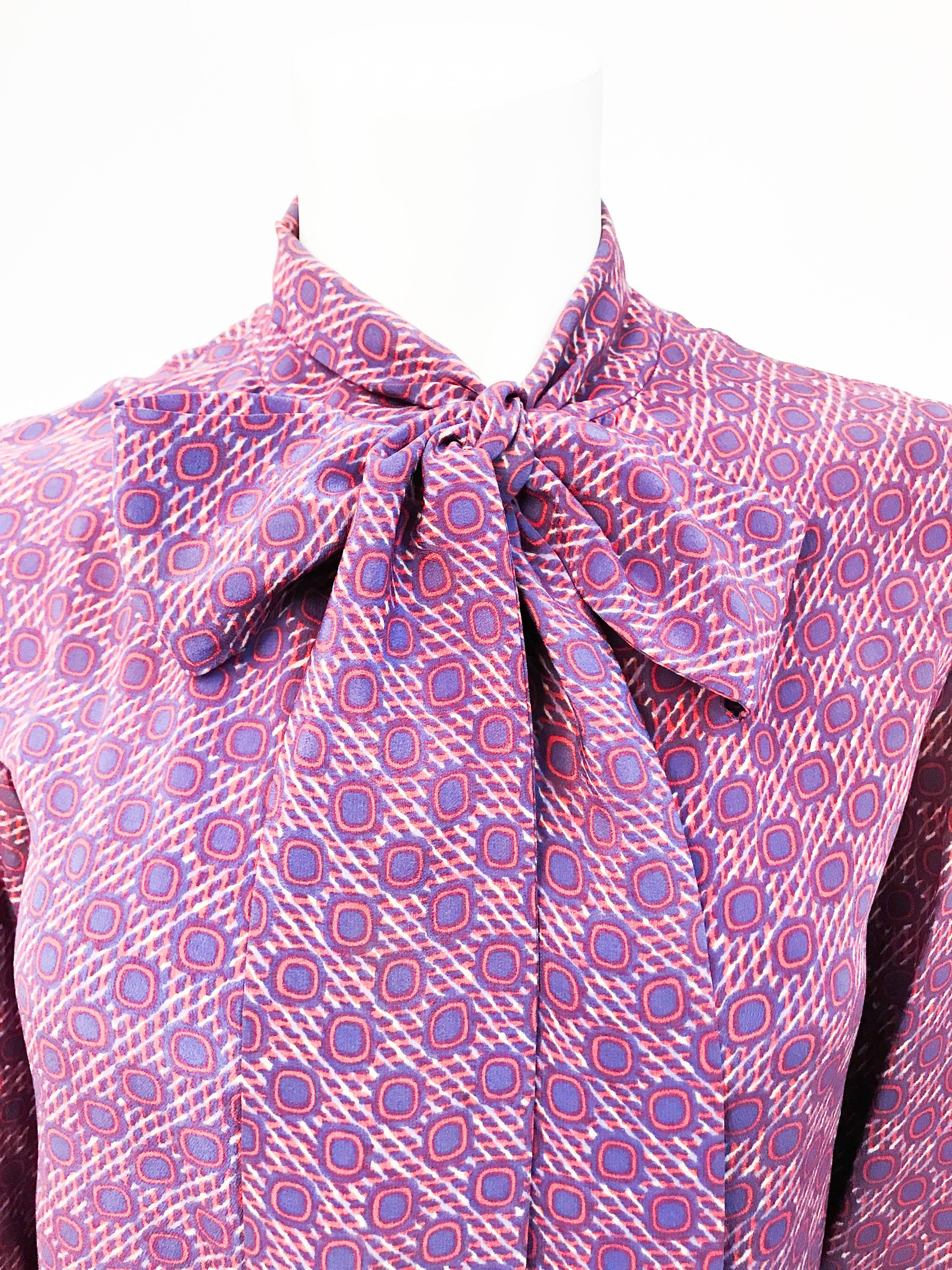 1970s Chanel Silk Printed Blouse with Attached Scarf. Silk printed blouse with long attached scarf and mother of pearl buttons.