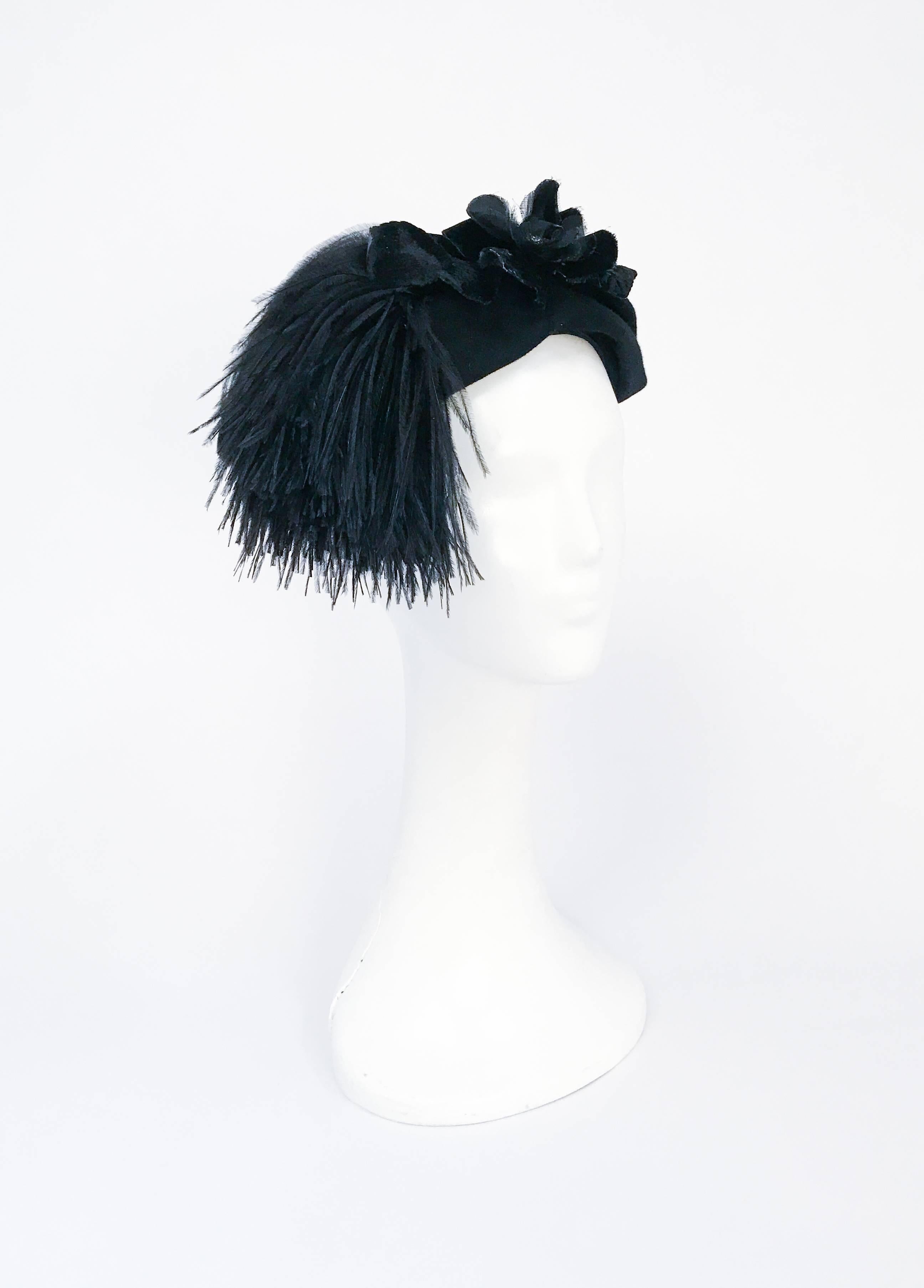 1950s Black Felt hat with Silk/Velvet Flower and Feather Accent. Black felt hat with black silk and velvet flower. Marabou feather accent piece.