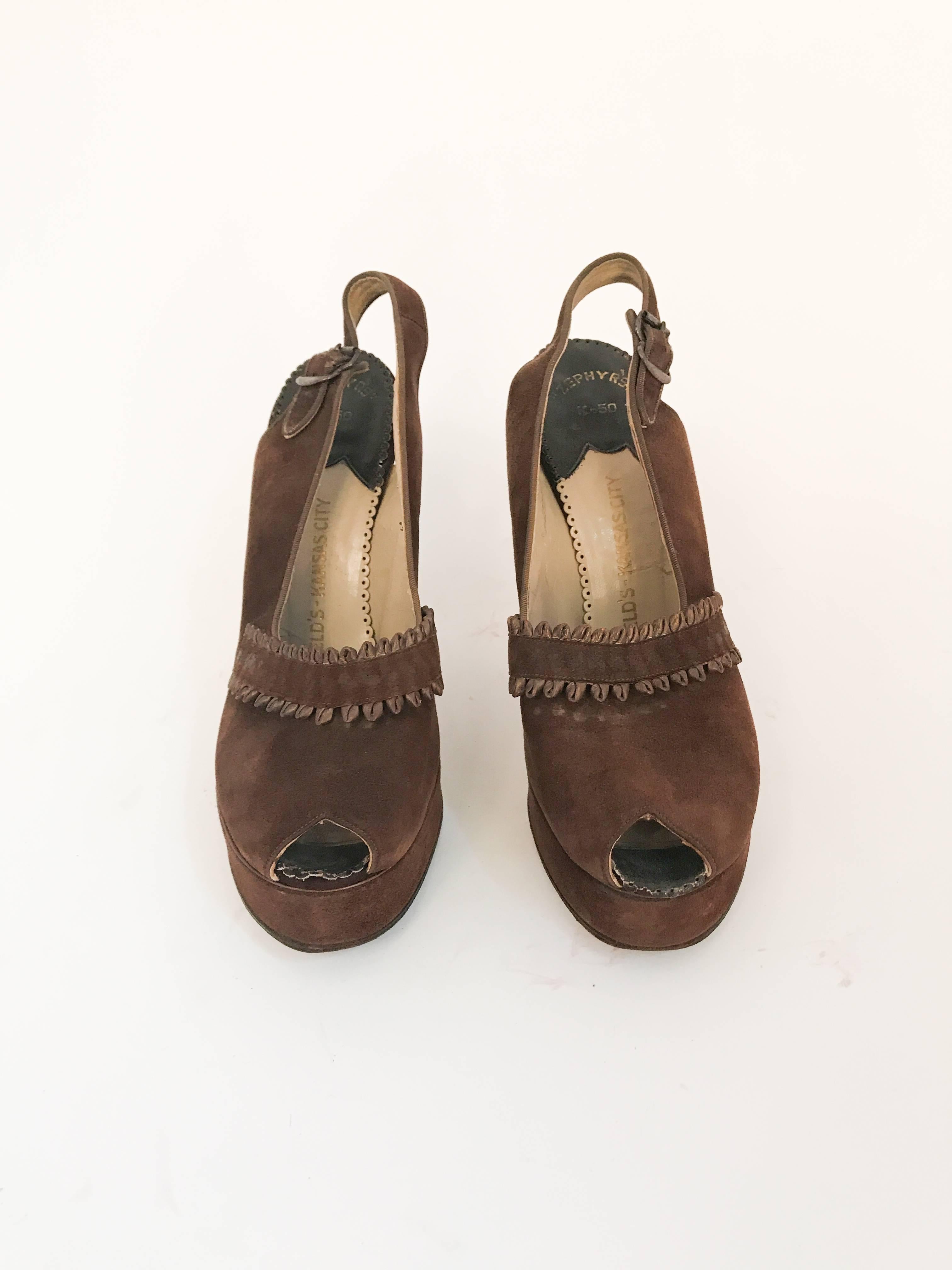 1947 Brown Suede and Leather Sling Back Heels. Brown Leather and suede heels with sling back and buckle closure. Suede and looped leather accent piece. 