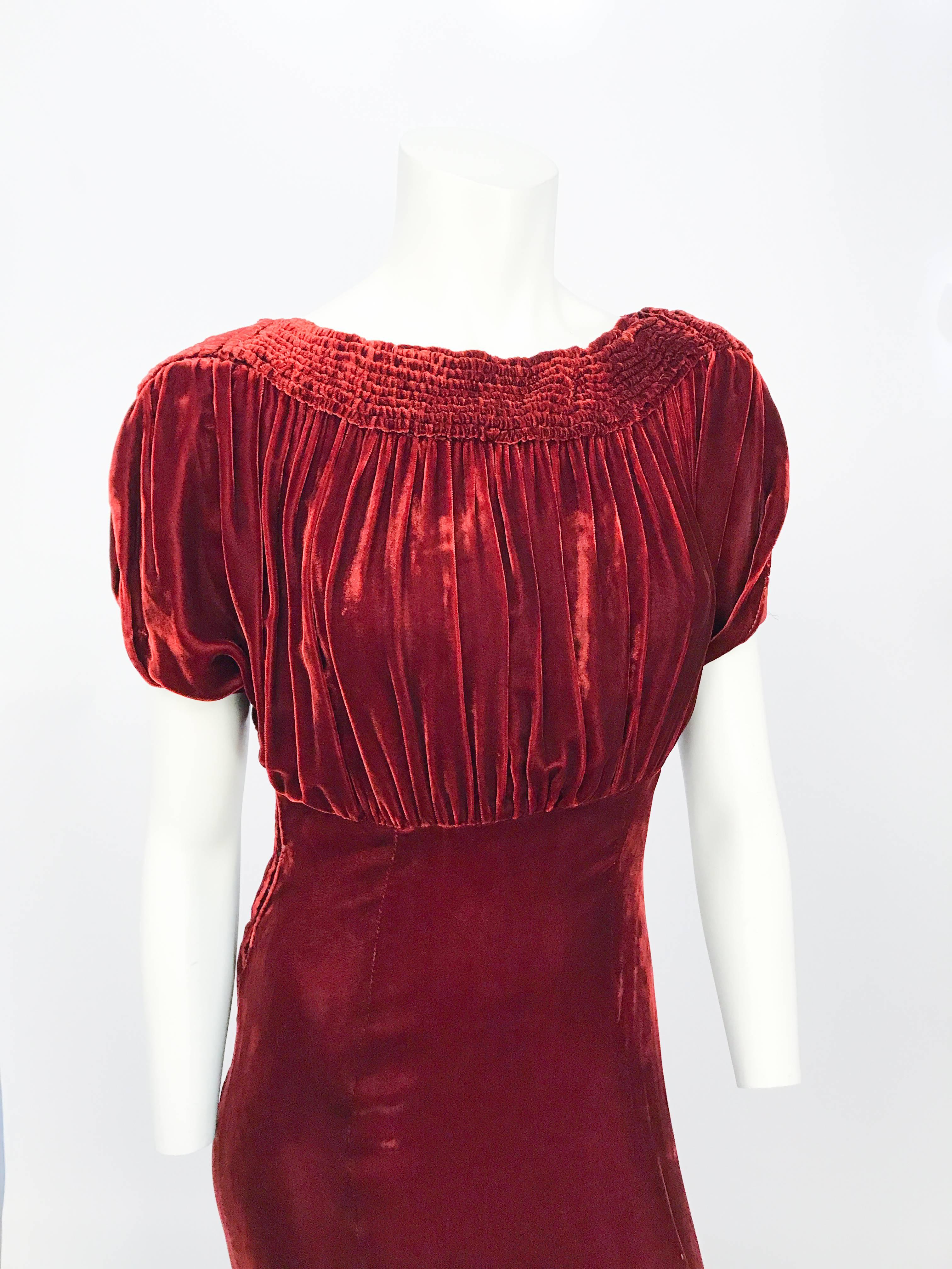 1930s Rust Bias Cut Silk Velvet Dress with Coat. Rust-colored Silk velvet dress with roused boat neckline, open slit sleeves. Jacked hast Placket opening, back gathering, cuffed sleeves, and flannel lining. Should suit a women around 5'9