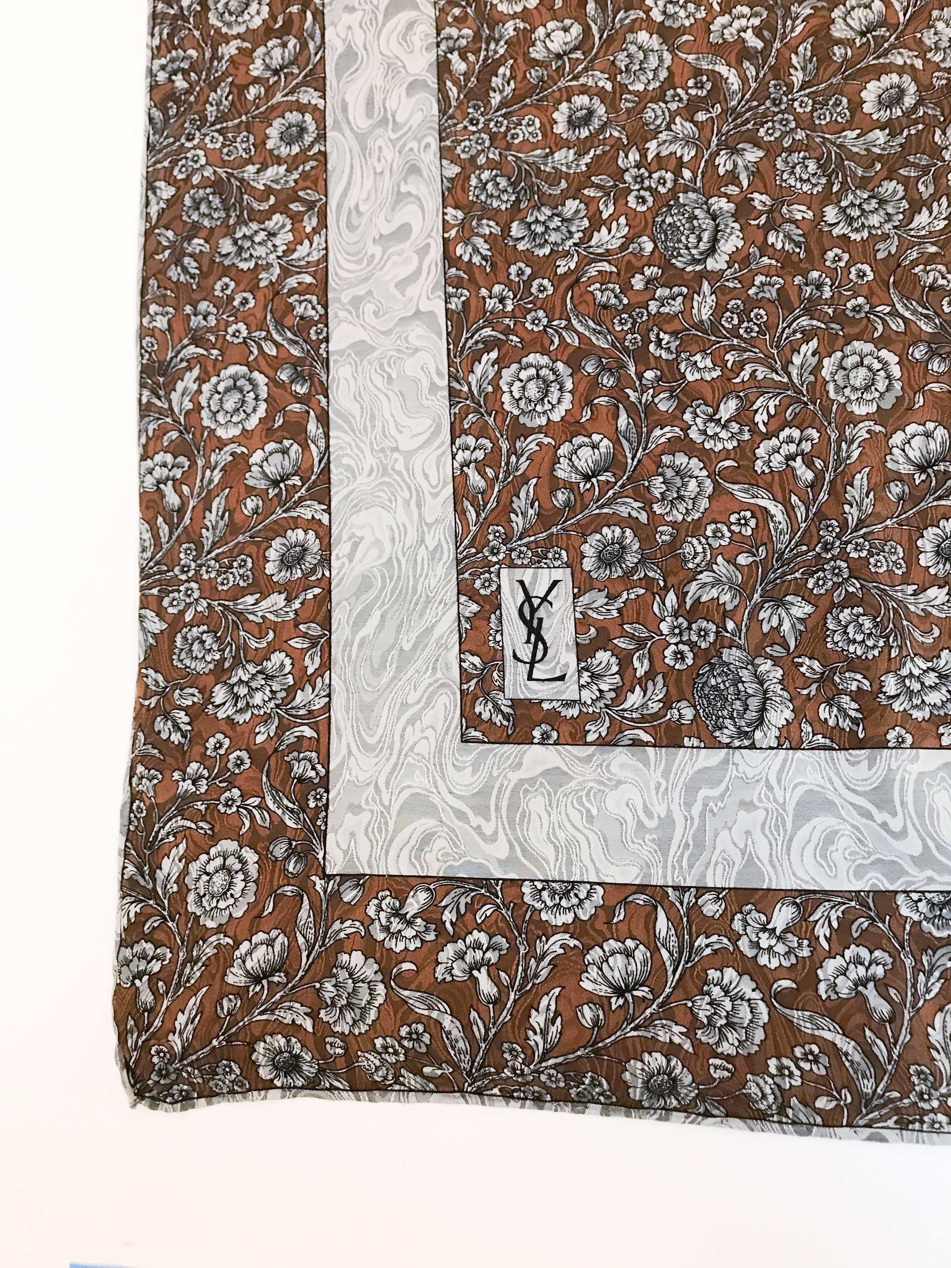 1970s Yves Saint Laurent Floral Printed Jacquard Silk Scarf. Brown and Grey floral printed scarf on Jacquard moire silk with hand-rolled edges and wide boarder. Very rare print and pattern. 