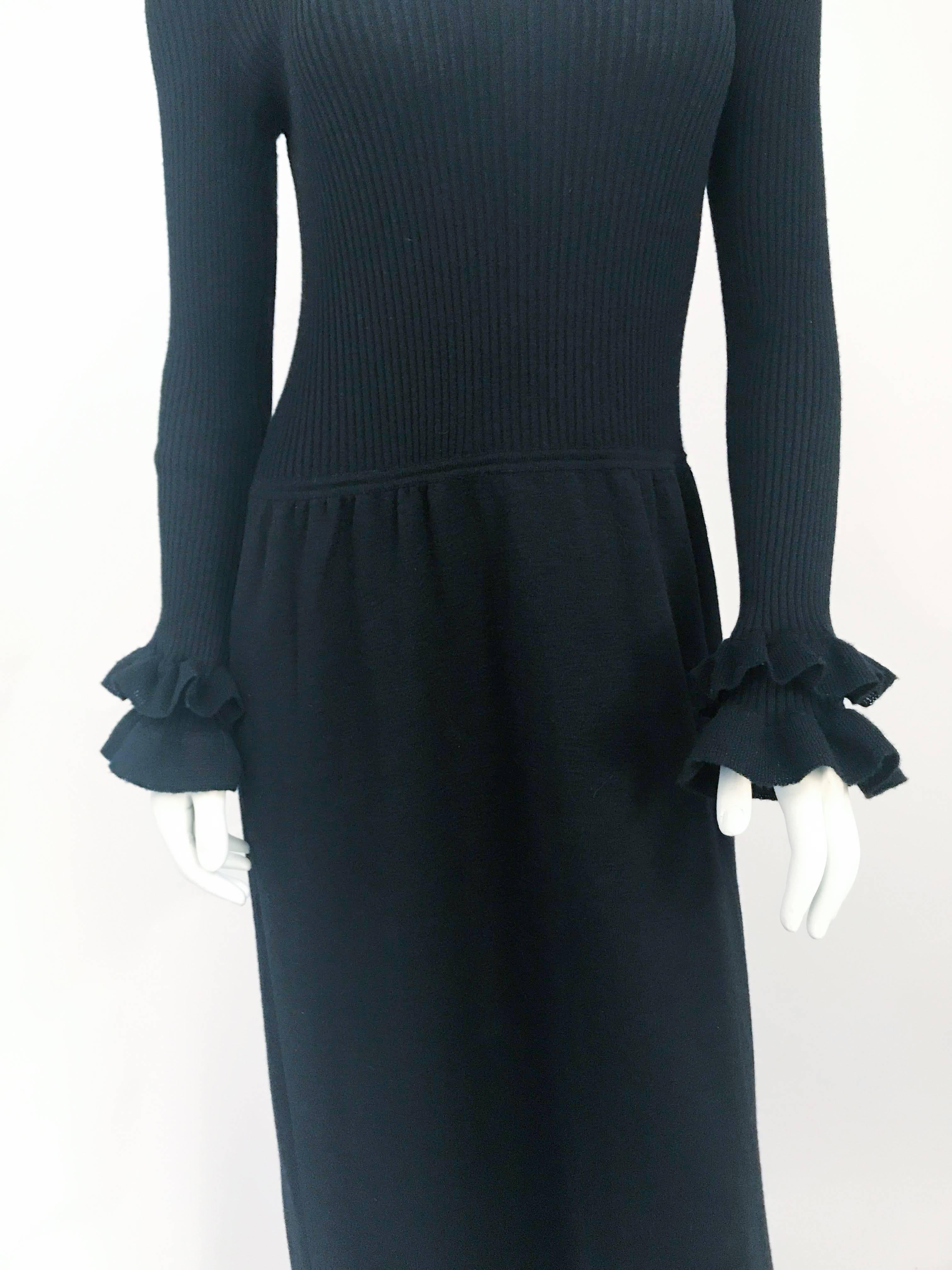 1970s Banff LTD by Gianni Ferri Black Knit Ruffled Dress. Black knit dress with ruffles along the cuff and hem. A comfortable non-itch wool and stretches.