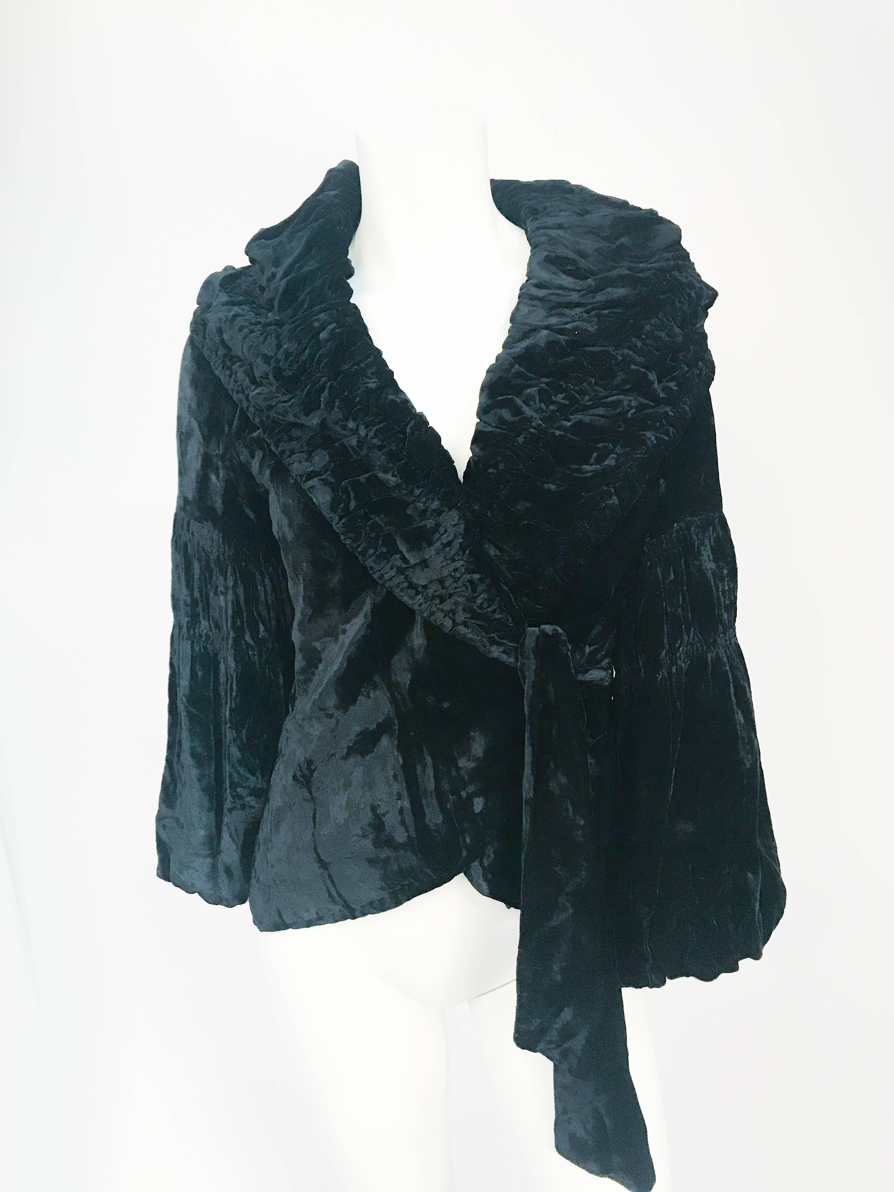 1930s Black Silk Velvet Evening Coat. Black silk velvet evenign coat with rouched sleeves and collar, fully lined in cashmere lining and lace edging, and side tie.