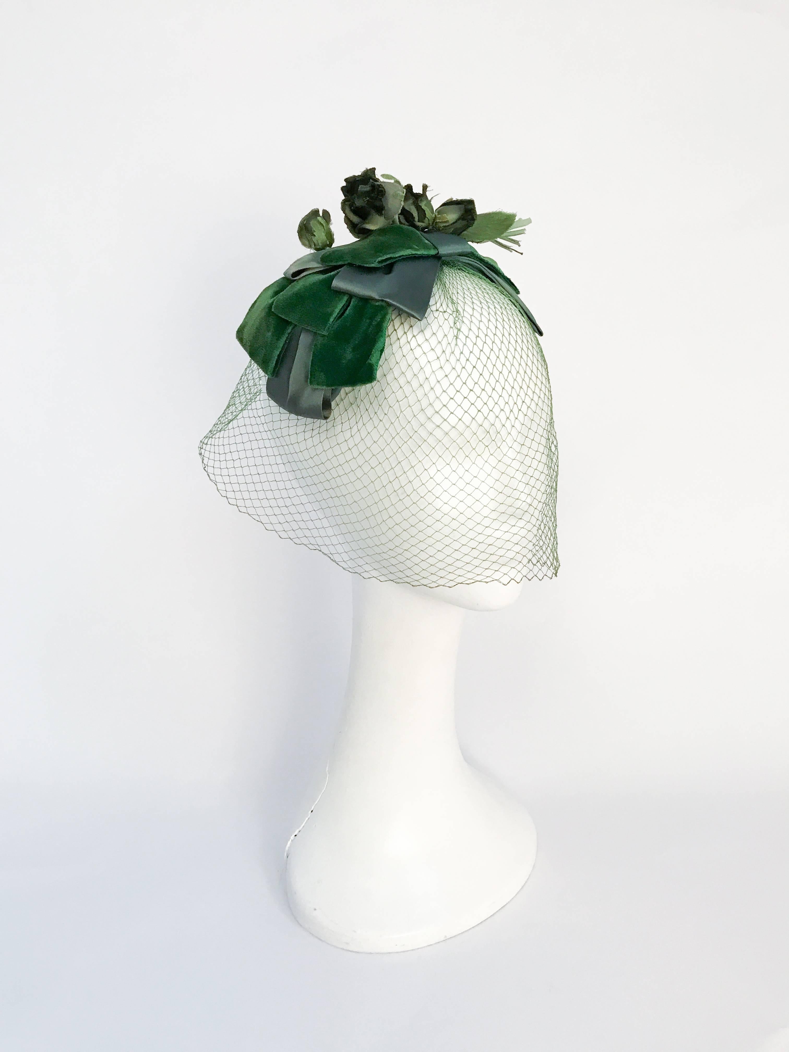 1950s Green Netted Cocktail Hat with Silk Roses. Green veiled cocktail hat with varying sades of green of handmade silk roses and satin/velvet ribbons.