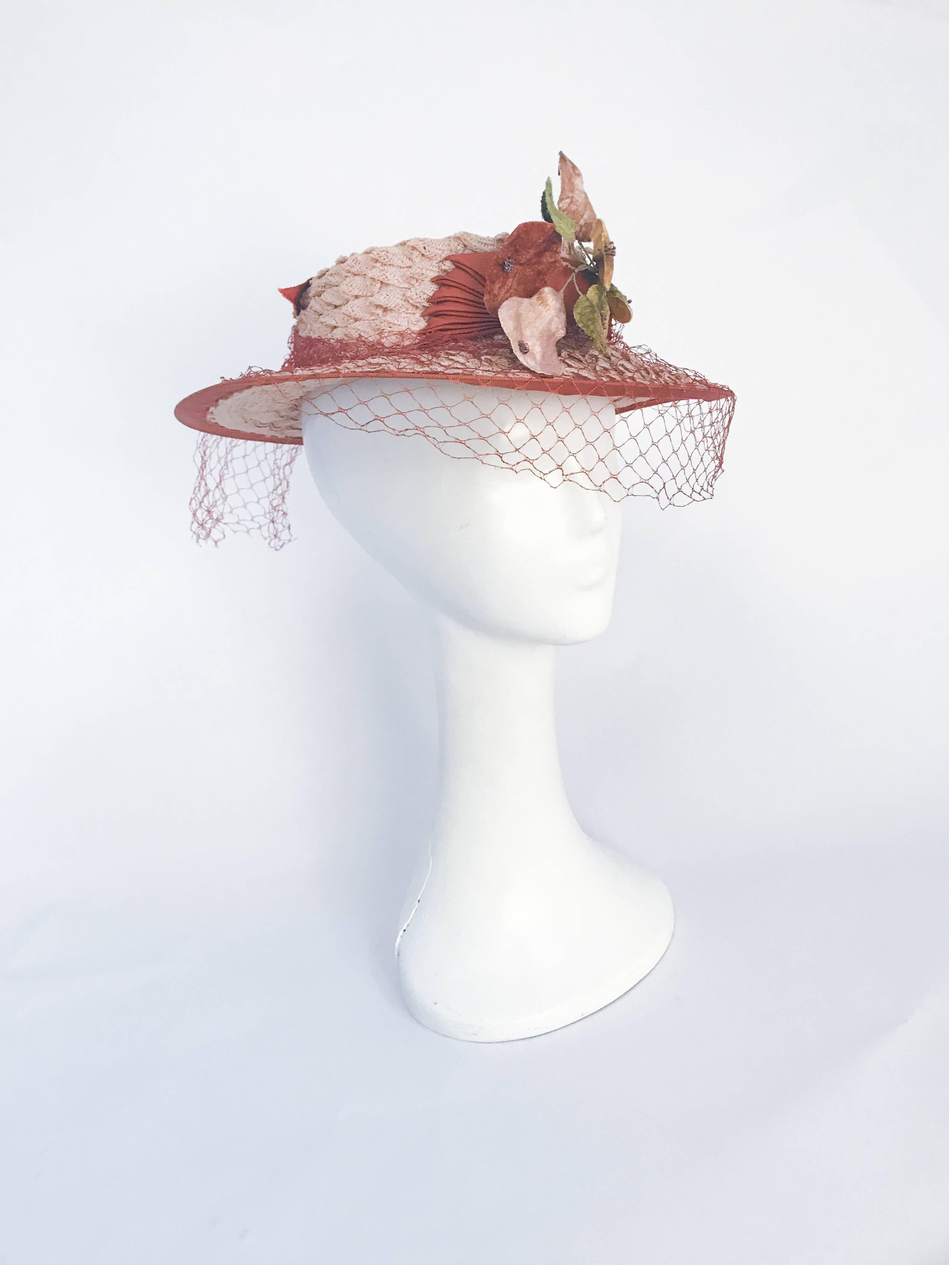 1940s Woven Coated Straw hat with Rust Trim and Velvet Fruit. Woven straw hat with gros grain trim in light rust color and velvet fruit. Matching veil and gros grain bow on the crown of the hat.