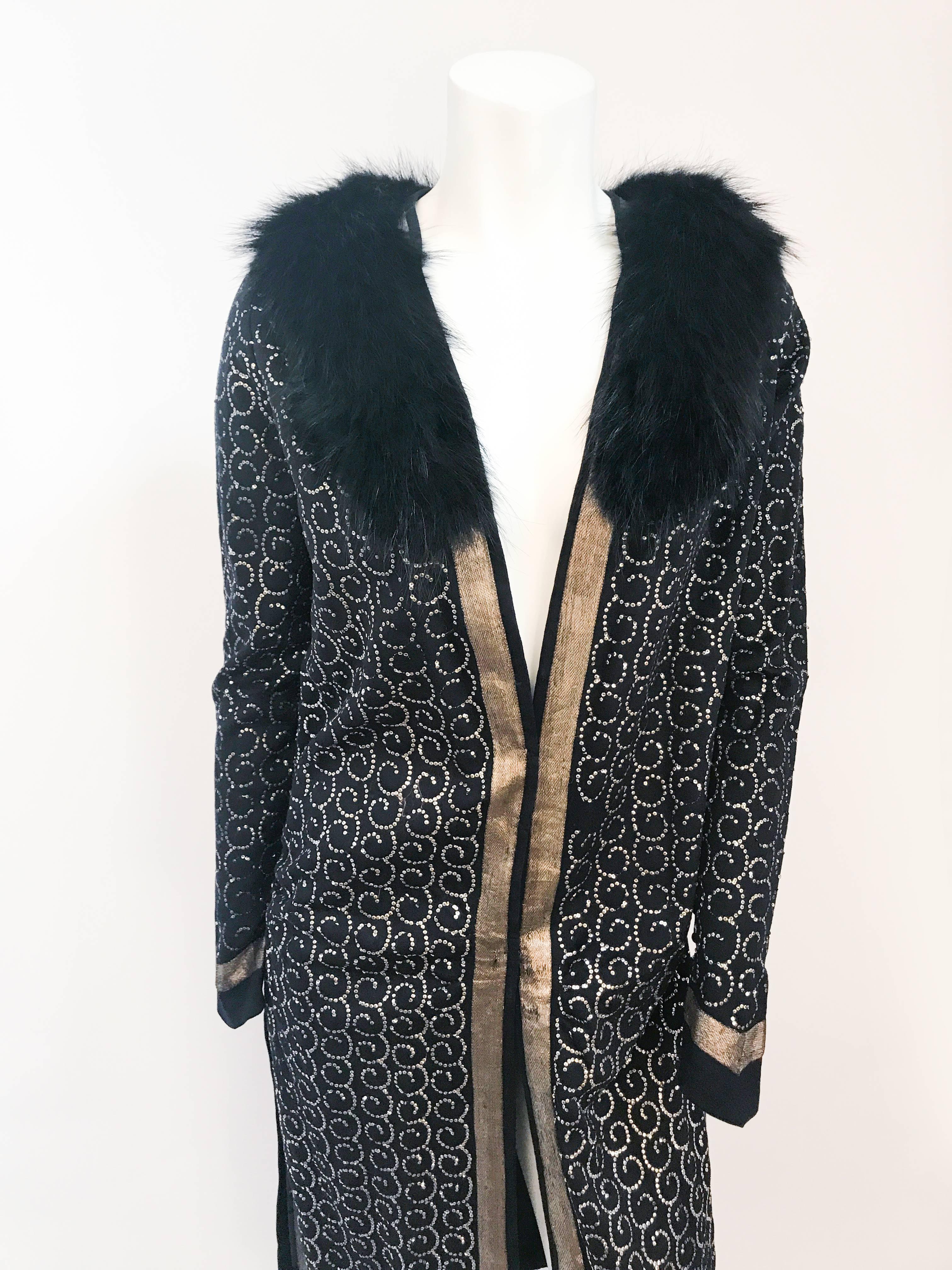 1920s Black Wool Evening Coat with Silver Sequins. Black wool gaberdine evening coat adorned with micro silver sequins. Gold Lamé trim at wrists and entire hem. Black fox fur collar and small covered button closed pointed wrists. Unlined.