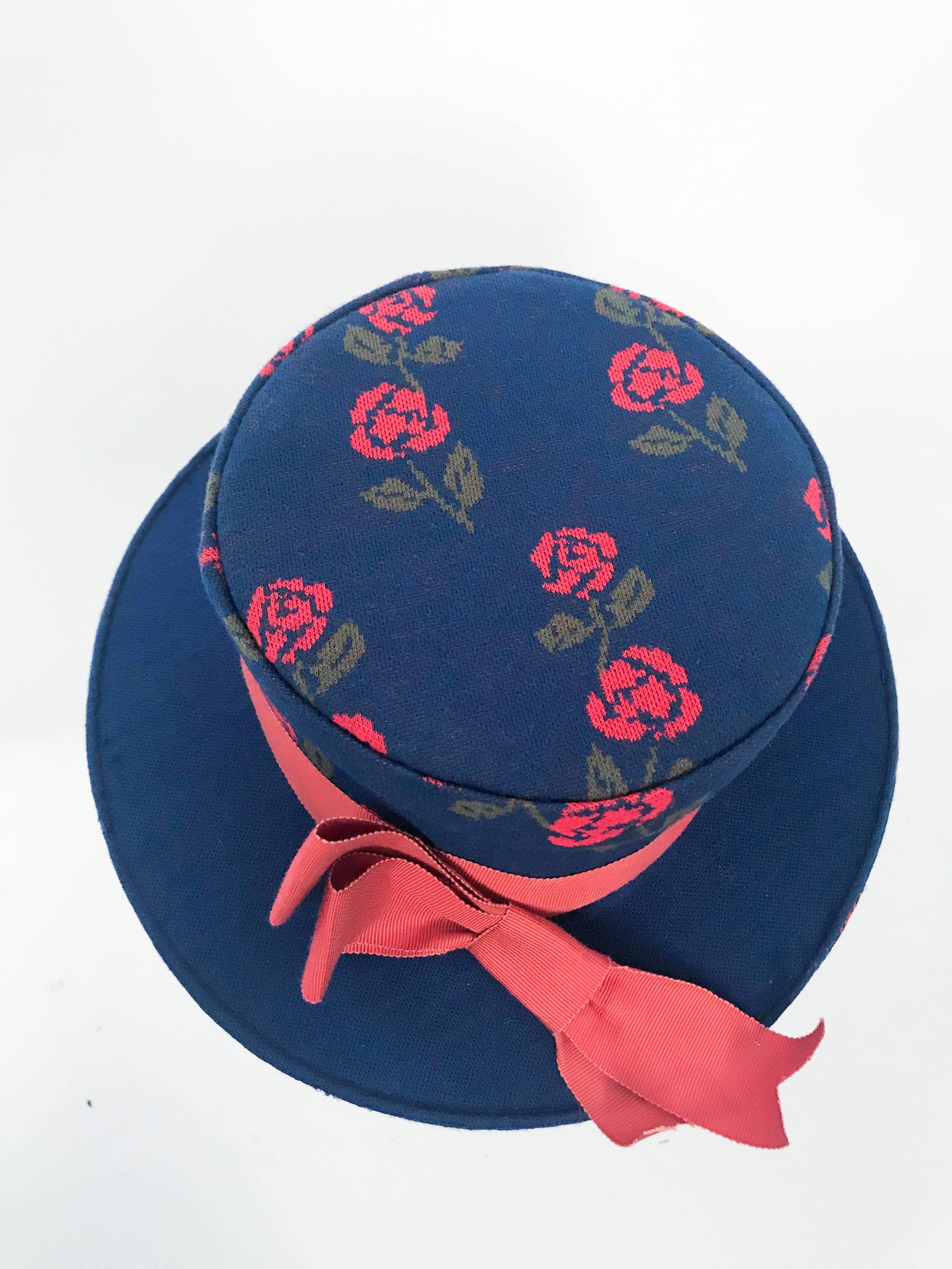 1960s Blue Woven Rose Hat with Rust Hat Band and Bow. Blue woven handmade boater hat with rust colored hatband and bow. Lining of red satin. Could be worn perched over the top of the head.