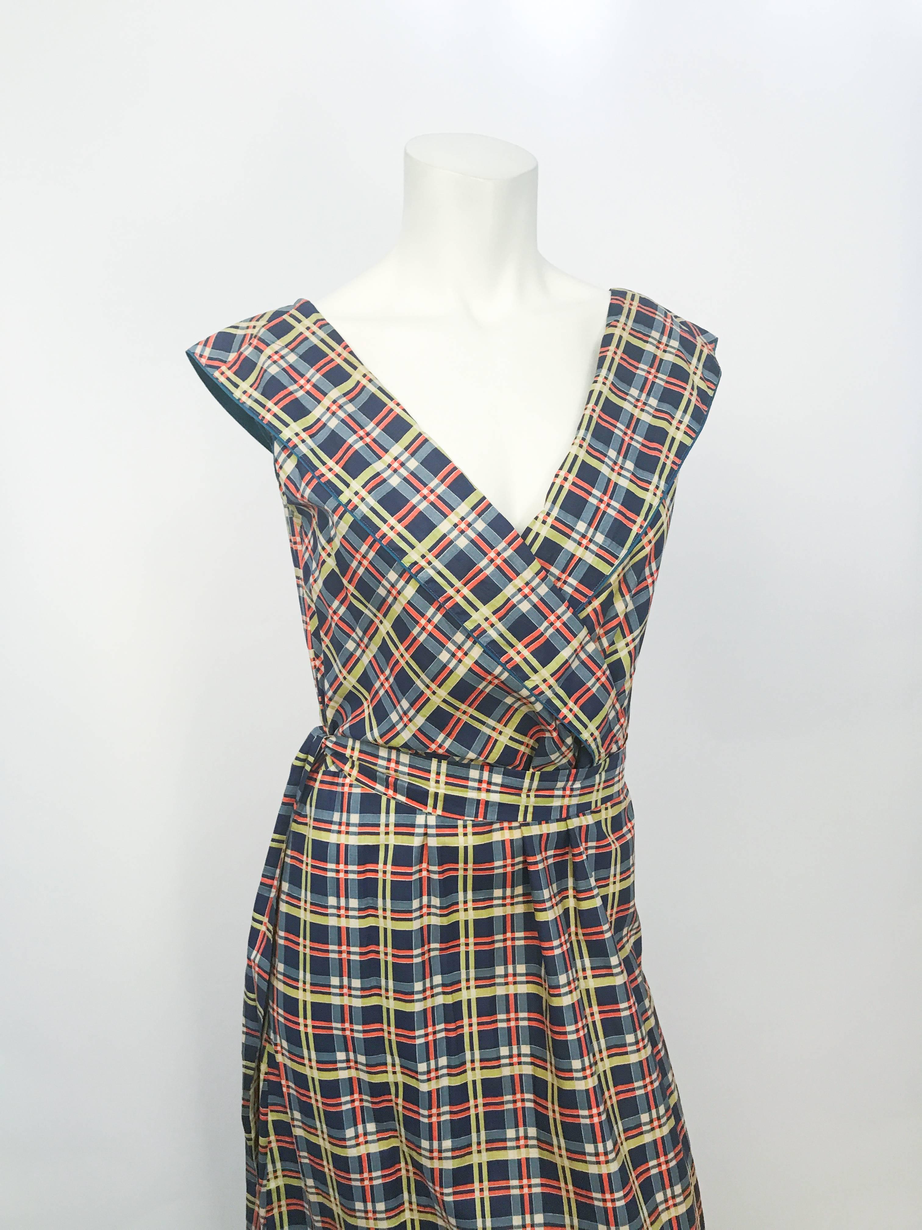 1930s Plaid Cotton Picnic Dress. Plaid cotton day dress with 2 tiers of ruffles at the hem. Frock. Surplice neckline, in a cornflower blue with matching sash. Goring also brings more fullness.
