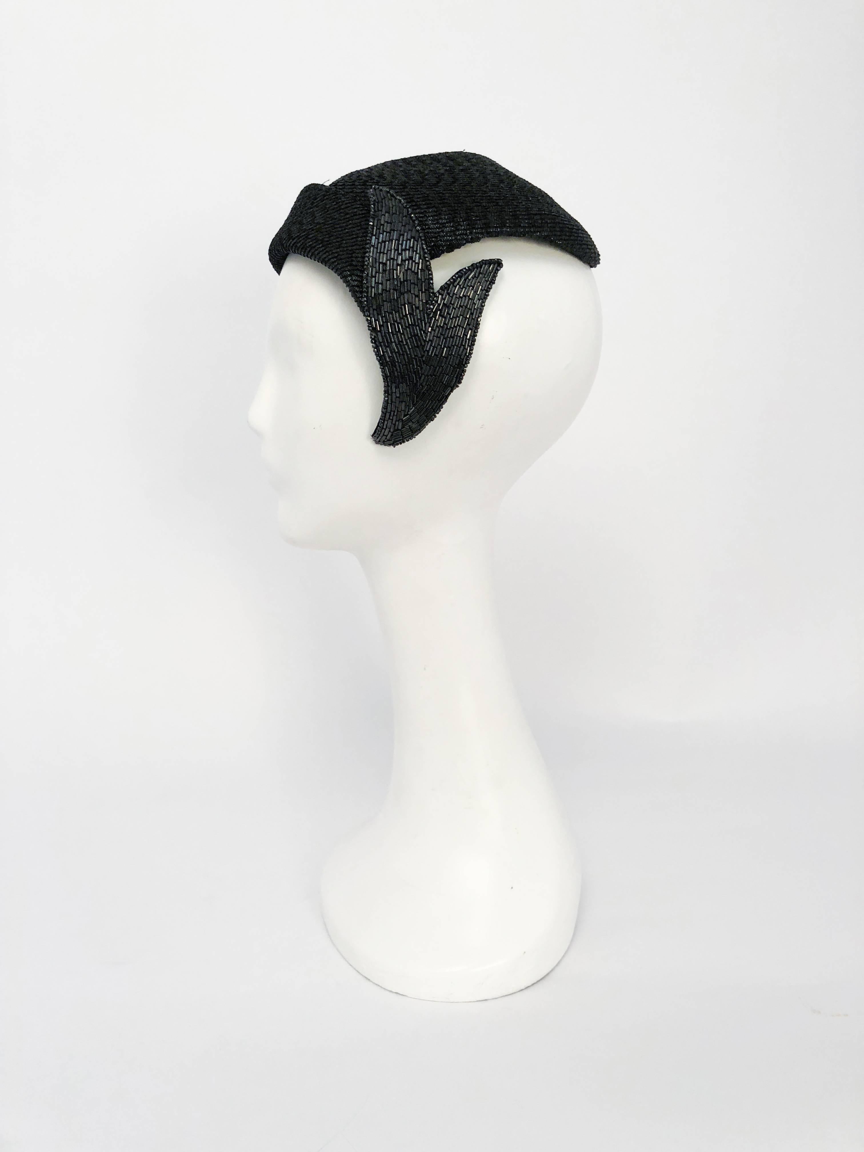 1950s Black Woven Straw Hat with Beaded Leaf. Black woven coated straw cocktail hat with bugle beaded leaf motif on one side. 