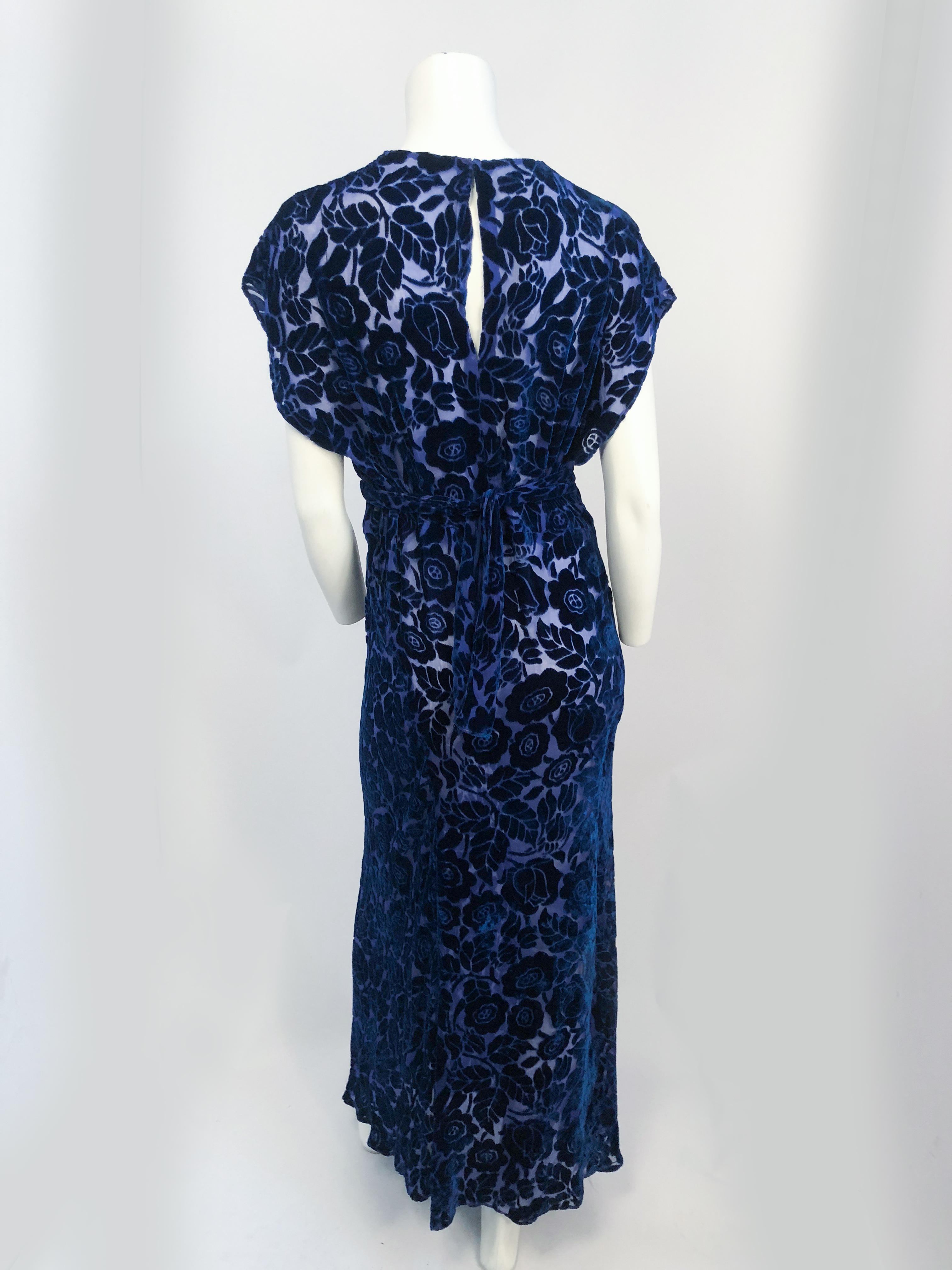 1930s Royal Blue Art Deco Cut Velvet Gown. Royal blue cut velvet gown with an art deco pattern. Sash around waist that ties at the back.