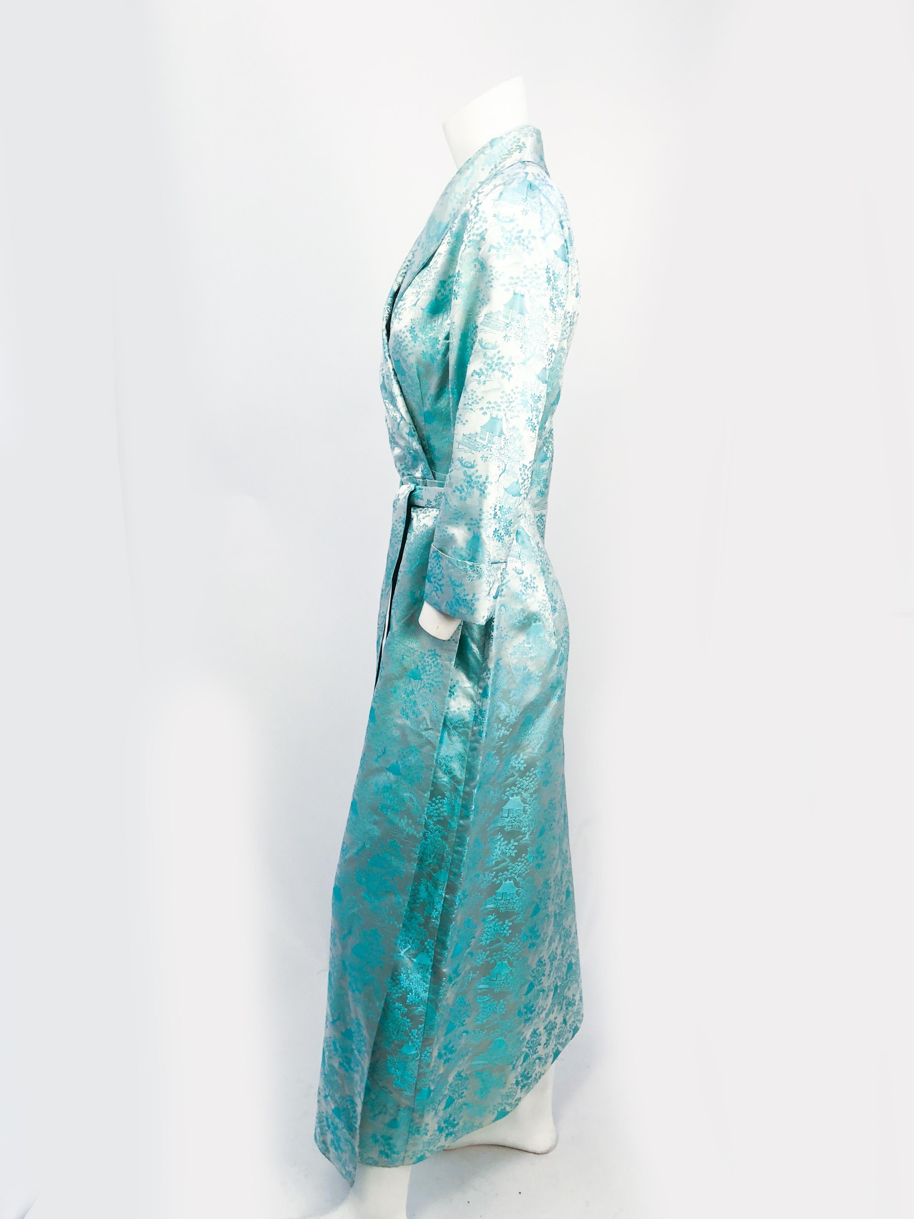 1950s Silk Brocade Dressing Gown. Powder blue silk brocade dressing gown/robe. Shawl collar, cuffed sleeves, original waist sash and front patch pocket.