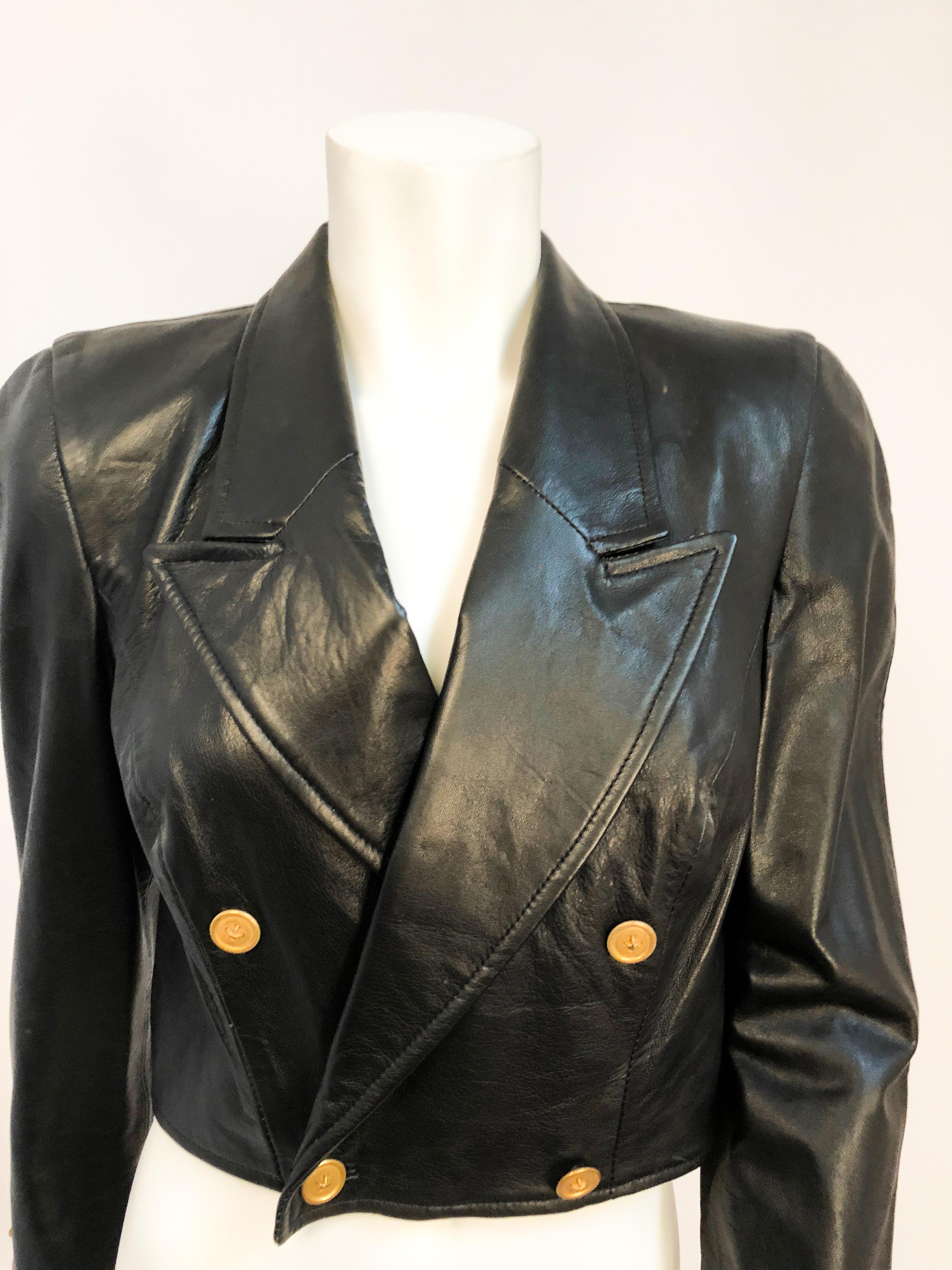 1980s North Beach Leather Jacket With Brass Buttons. Also features padded shoulders, brass buttons, and double breasts. 