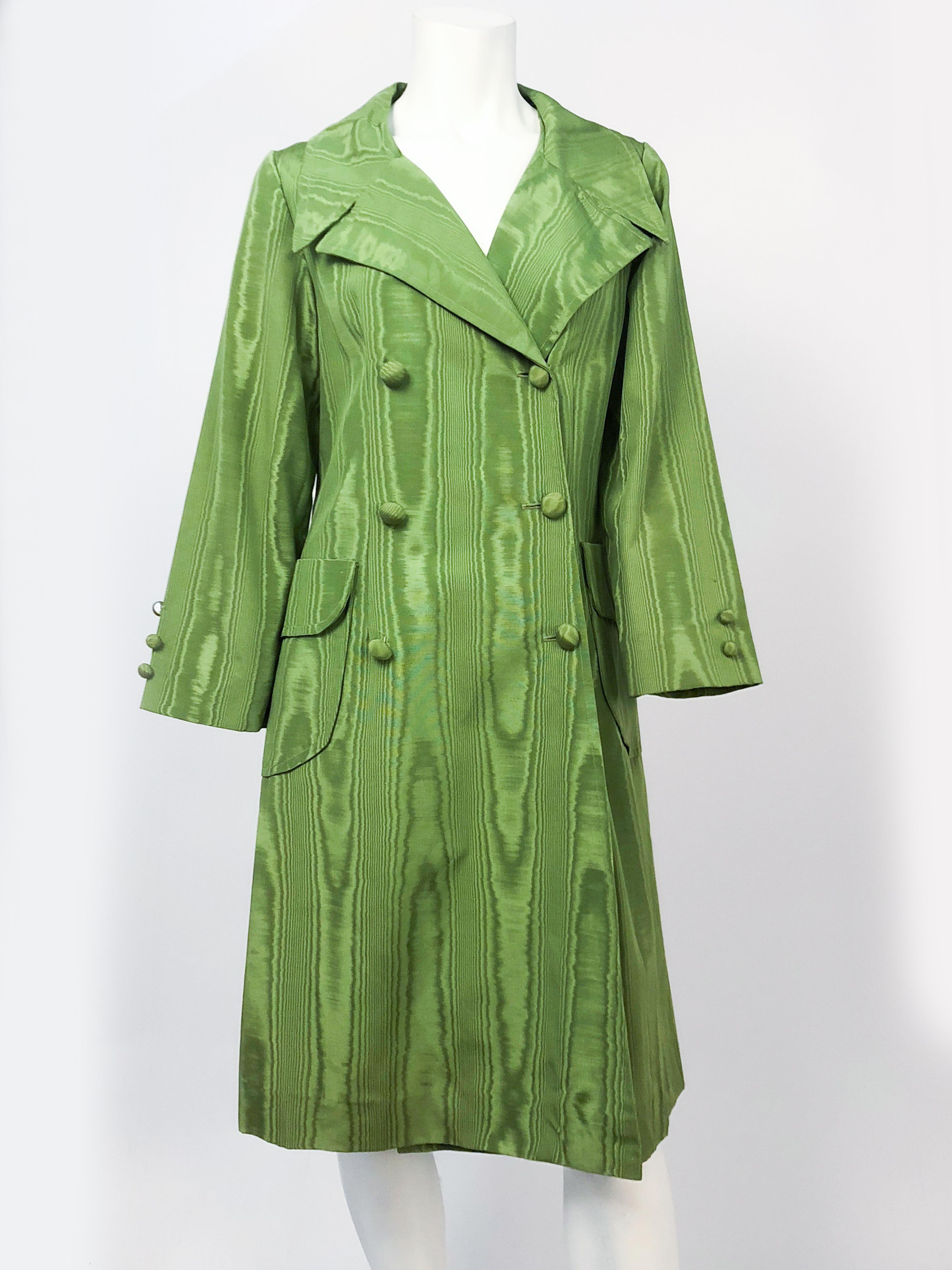 1970s Avocado Green Moire Coat featuring covered buttons, 2 front oversized pockets, tapered A-line to the knee.