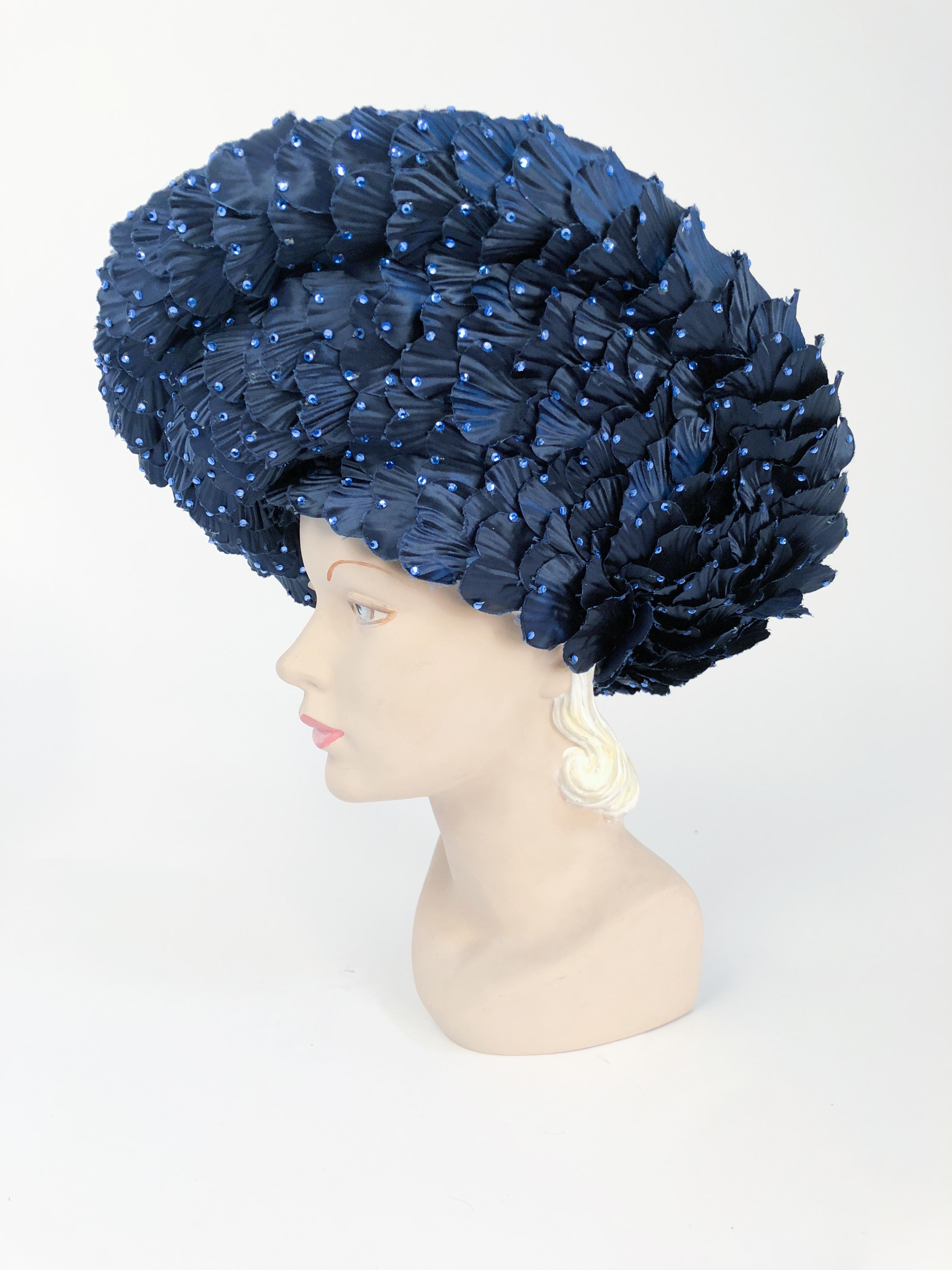 1980s Jack McConnell Navy Straw and Satin Hat. Navy hat with hand-cut satin petals adorned with rhinestones. Petal cover entire body of the hat and the hat band. 