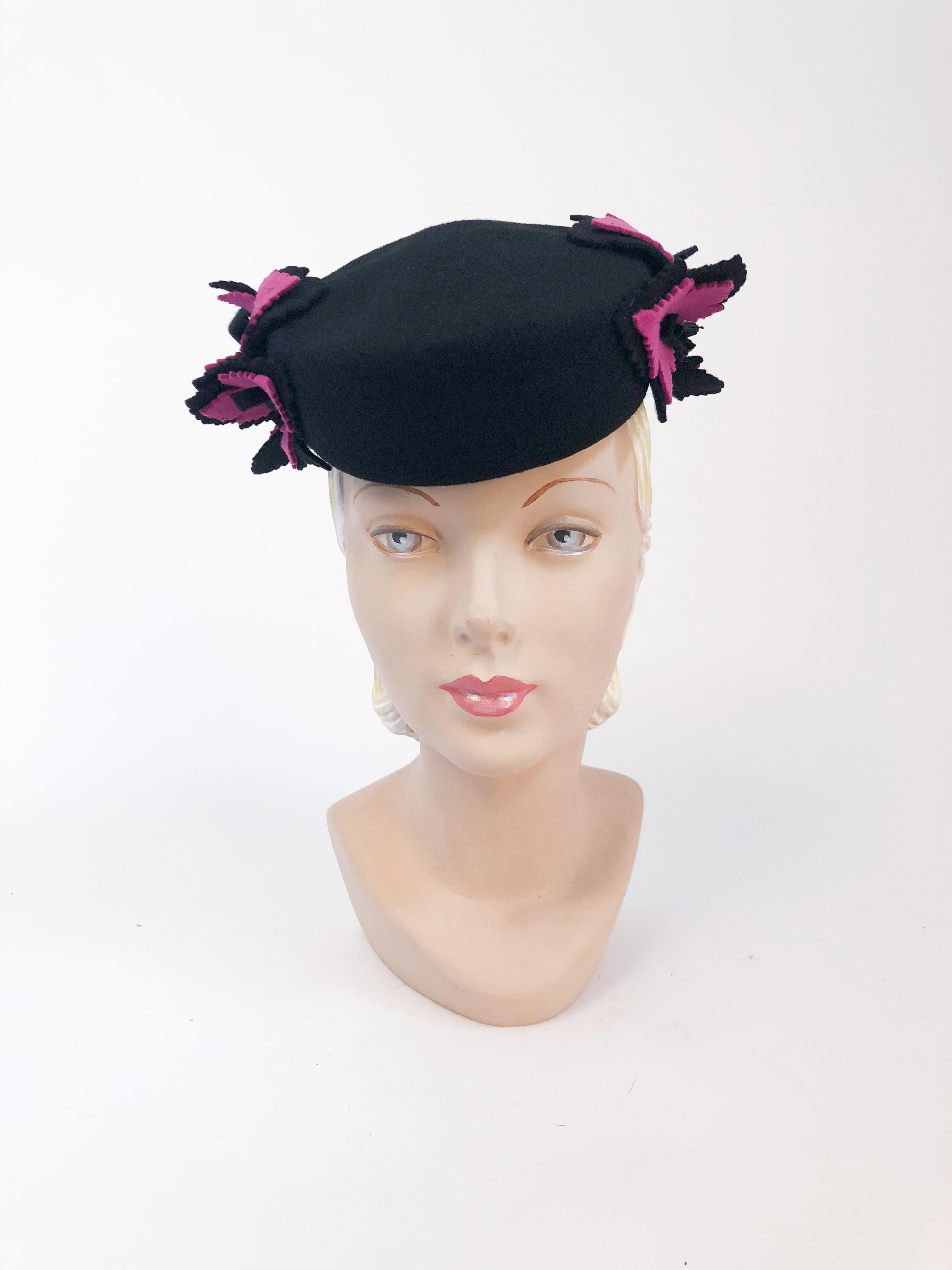 1940s Black and Magenta Wool Felt hat with Hand-cut leaves. Black wool felt hat with hand-cut black and magenta maple leaves, and structured keeper to hold hat in place. Also has elastic to further secure the hat to the head.