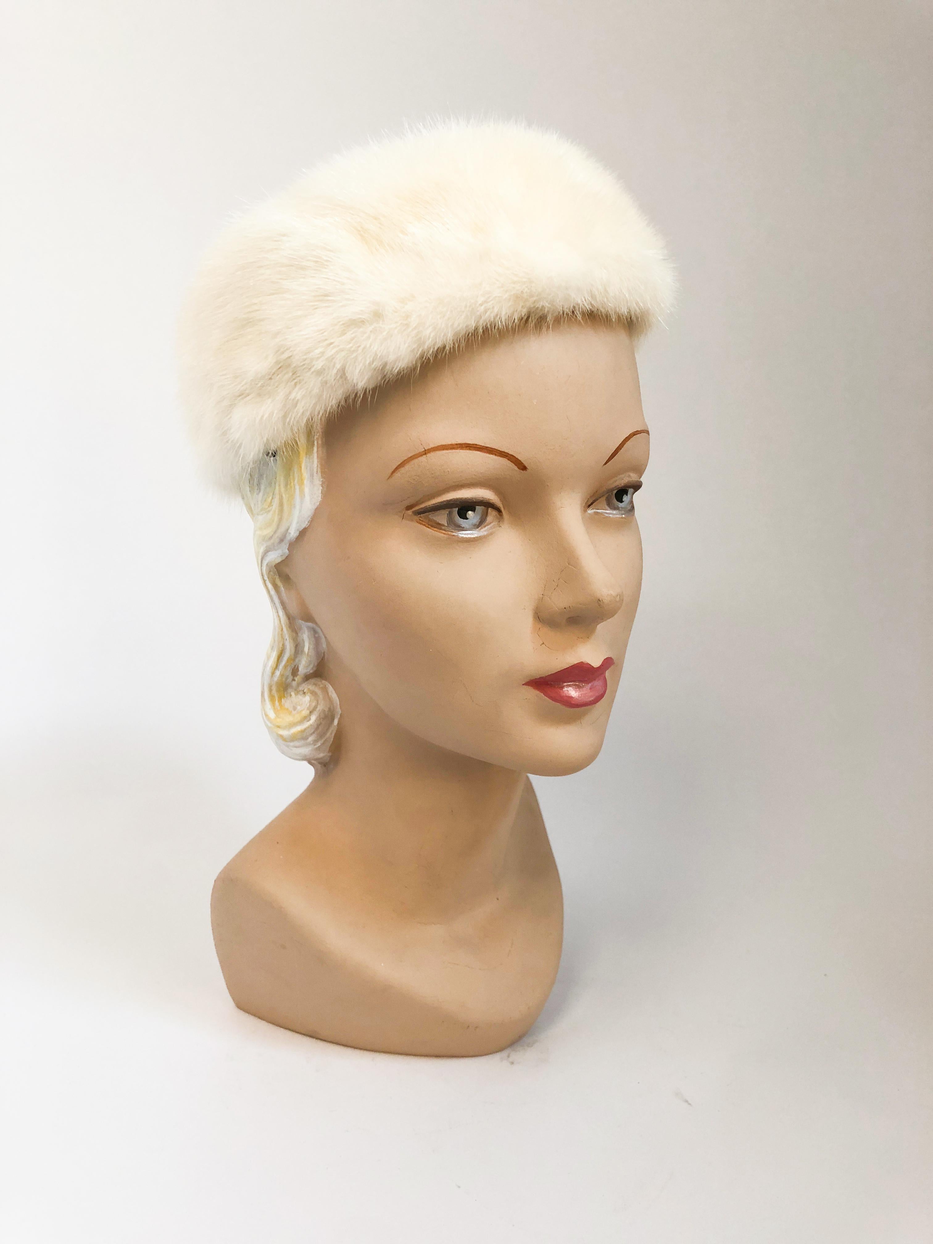 1960s I. Magnin white mink fur hat with satin lining and hair clips on the interior sides.