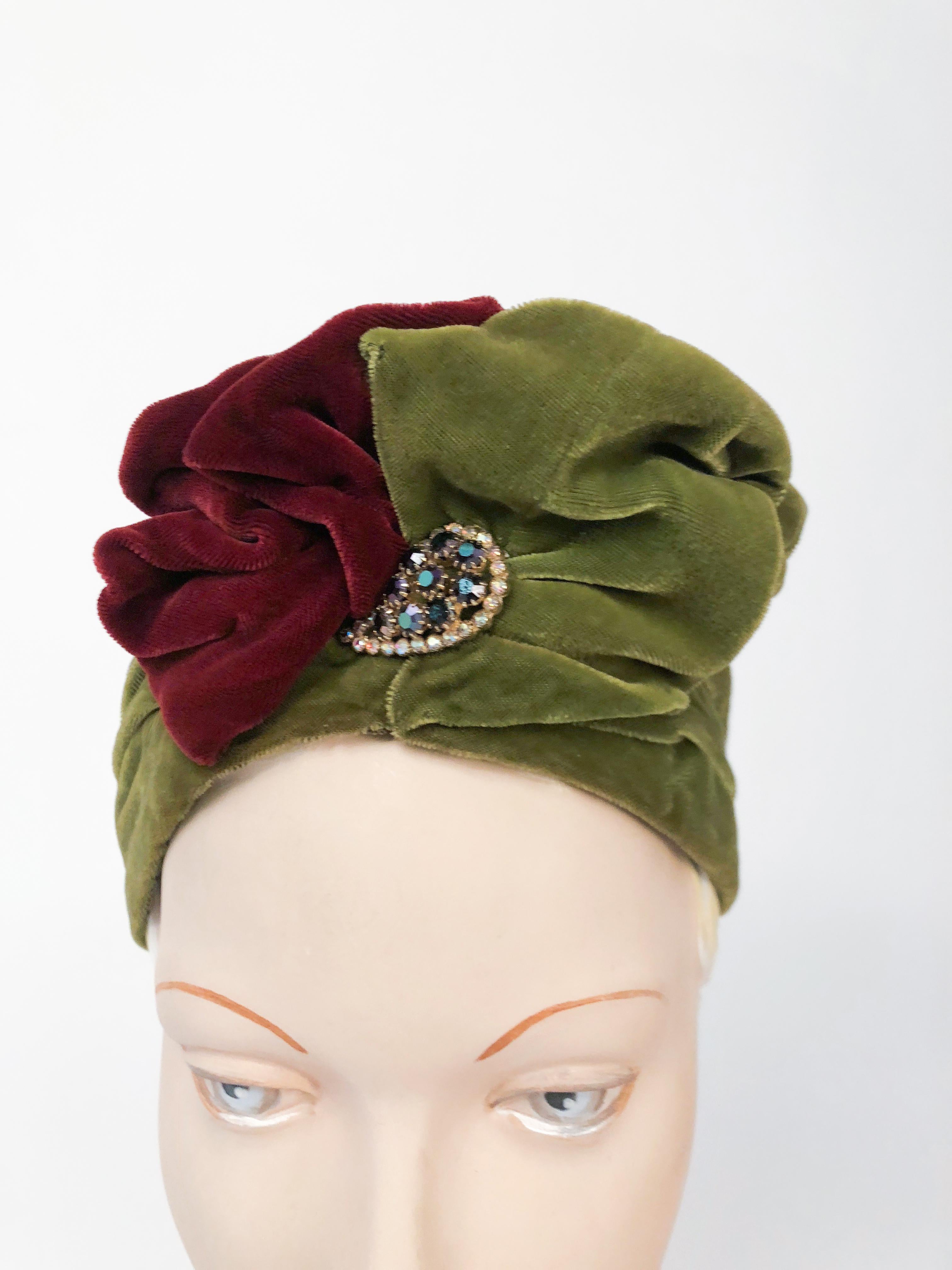 1930s Green and Cranberry Silk Velvet Turban. Green and cranberry silk velvet gathered turban with a rhinestone accent piece. 
