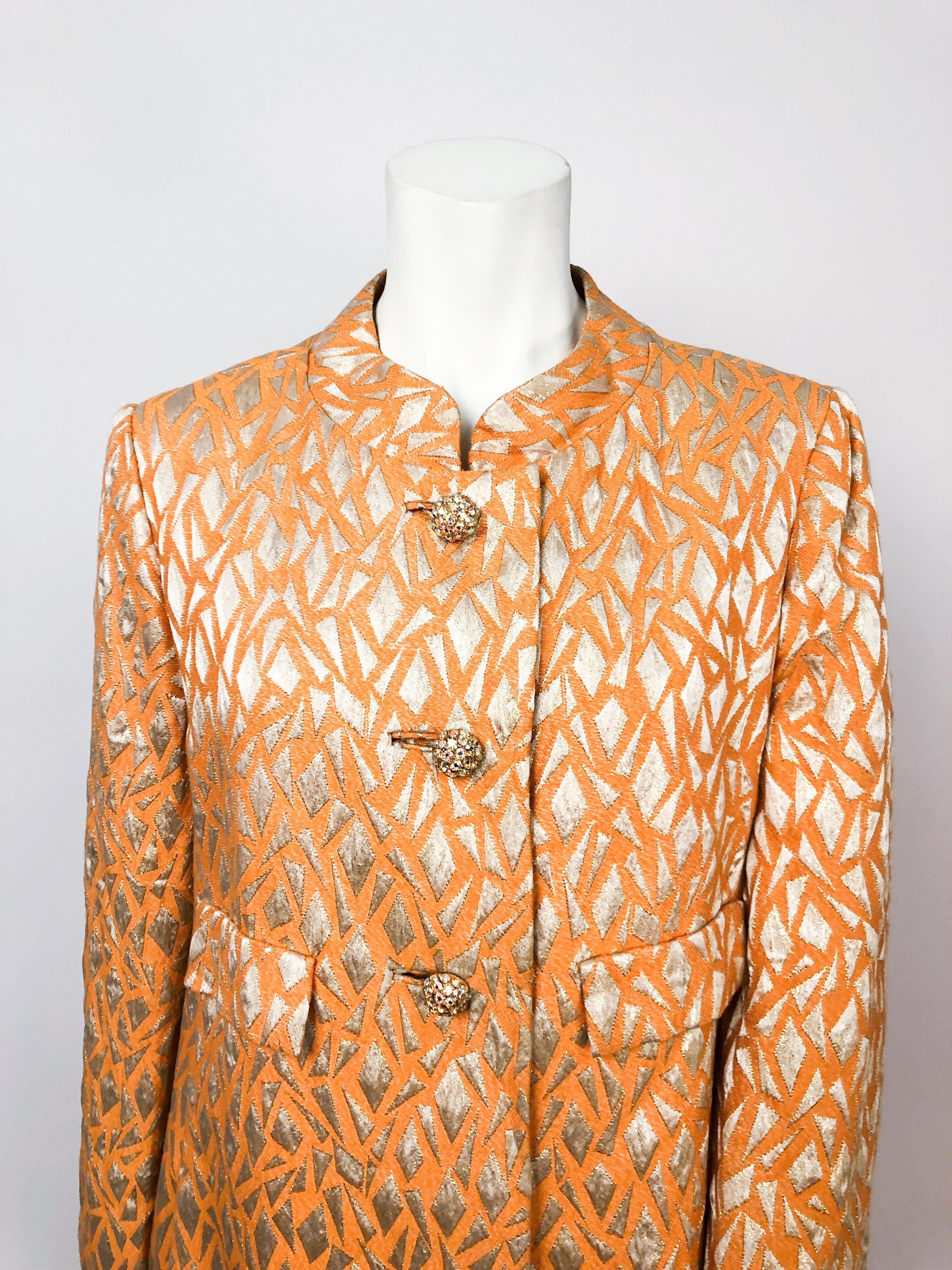 1960s Mardi Gras Orange Evening Coat with Metallic Brocade. Orange and silver lurex brocade pattern a-line evening coat with rhinestone encrusted buttons and inset button holes